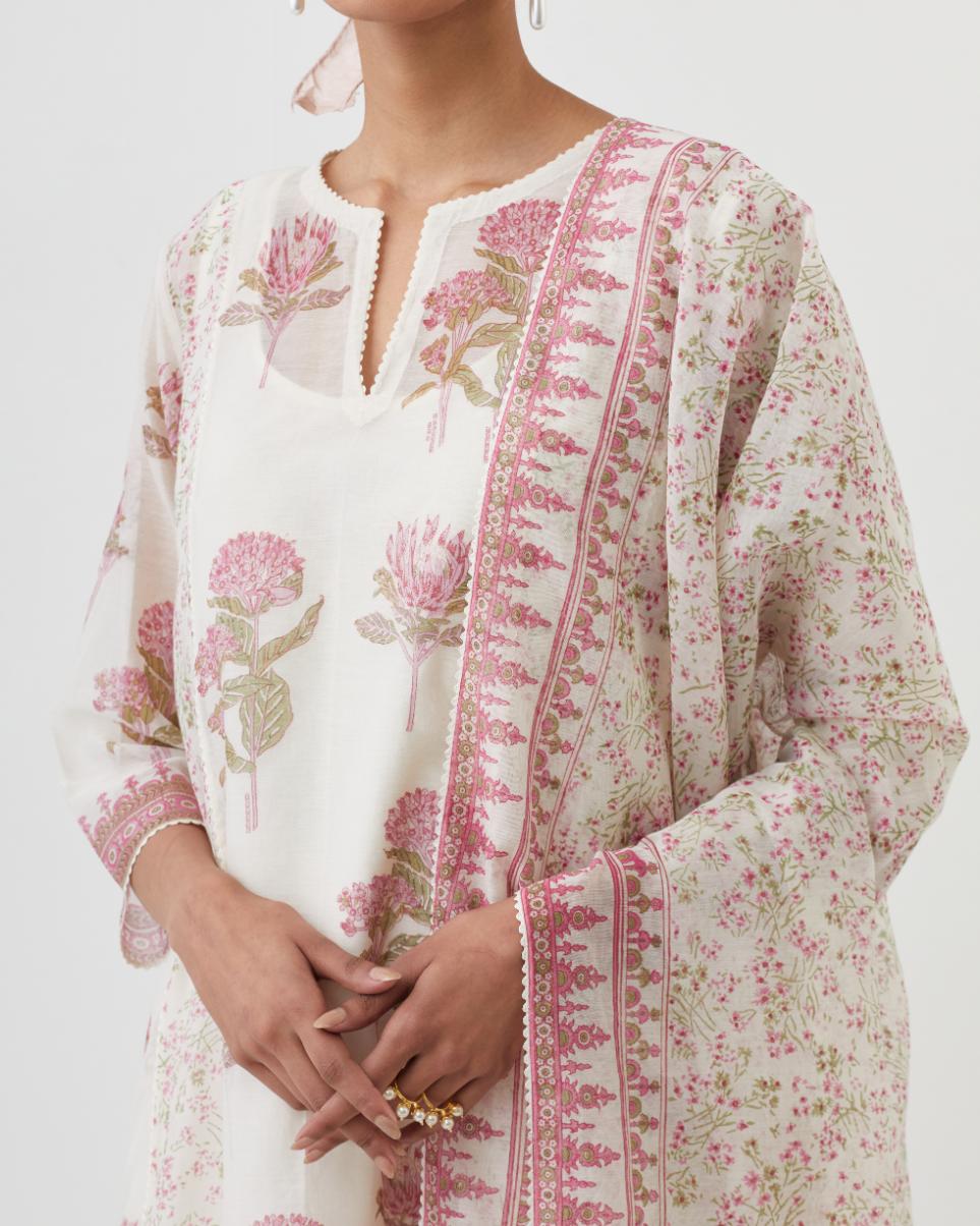 Off white hand block printed cotton chanderi short kalidar kurta set with all-over pink colored flower.