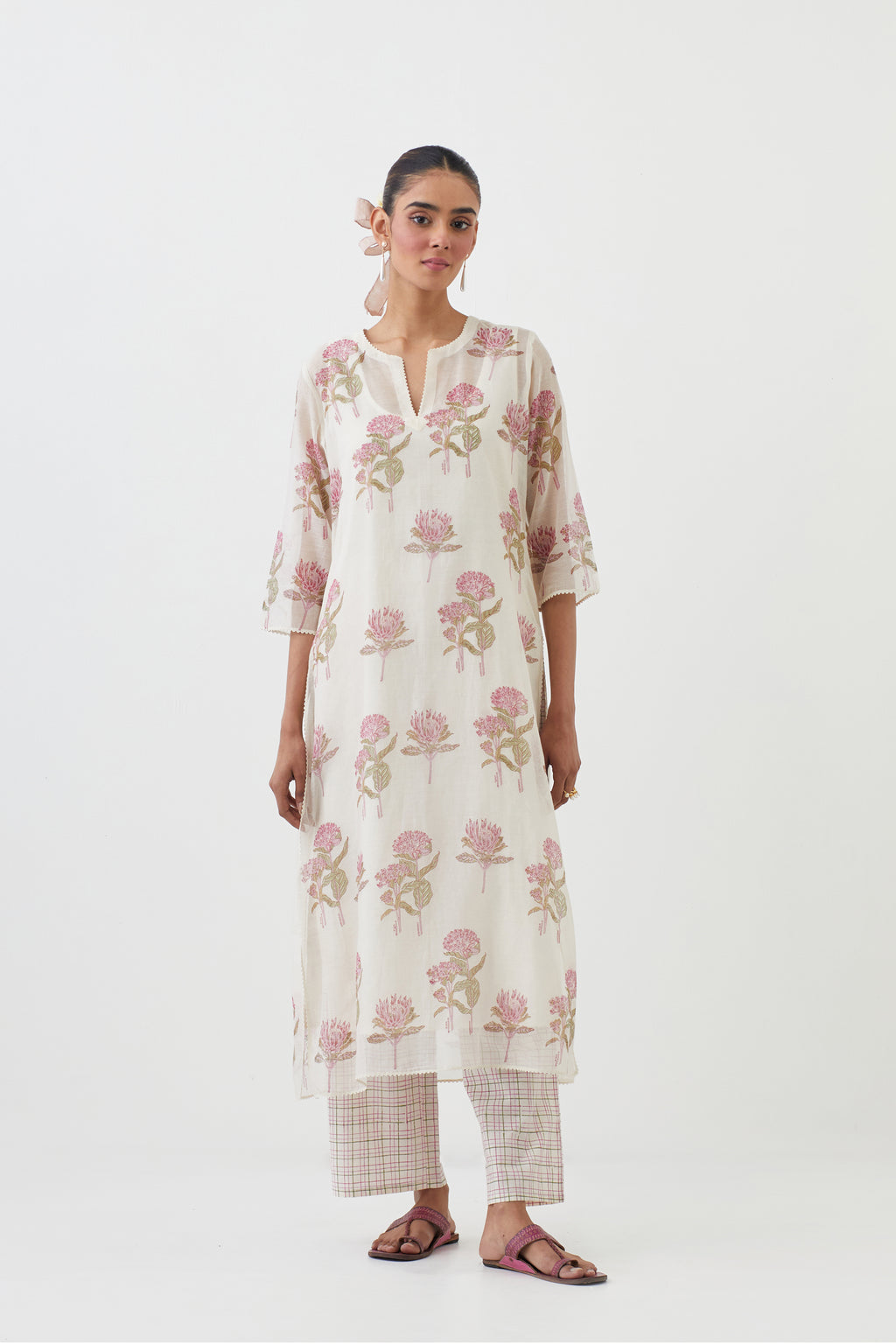 Off white cotton chanderi hand block printed kurta set with all-over pink colored flower.