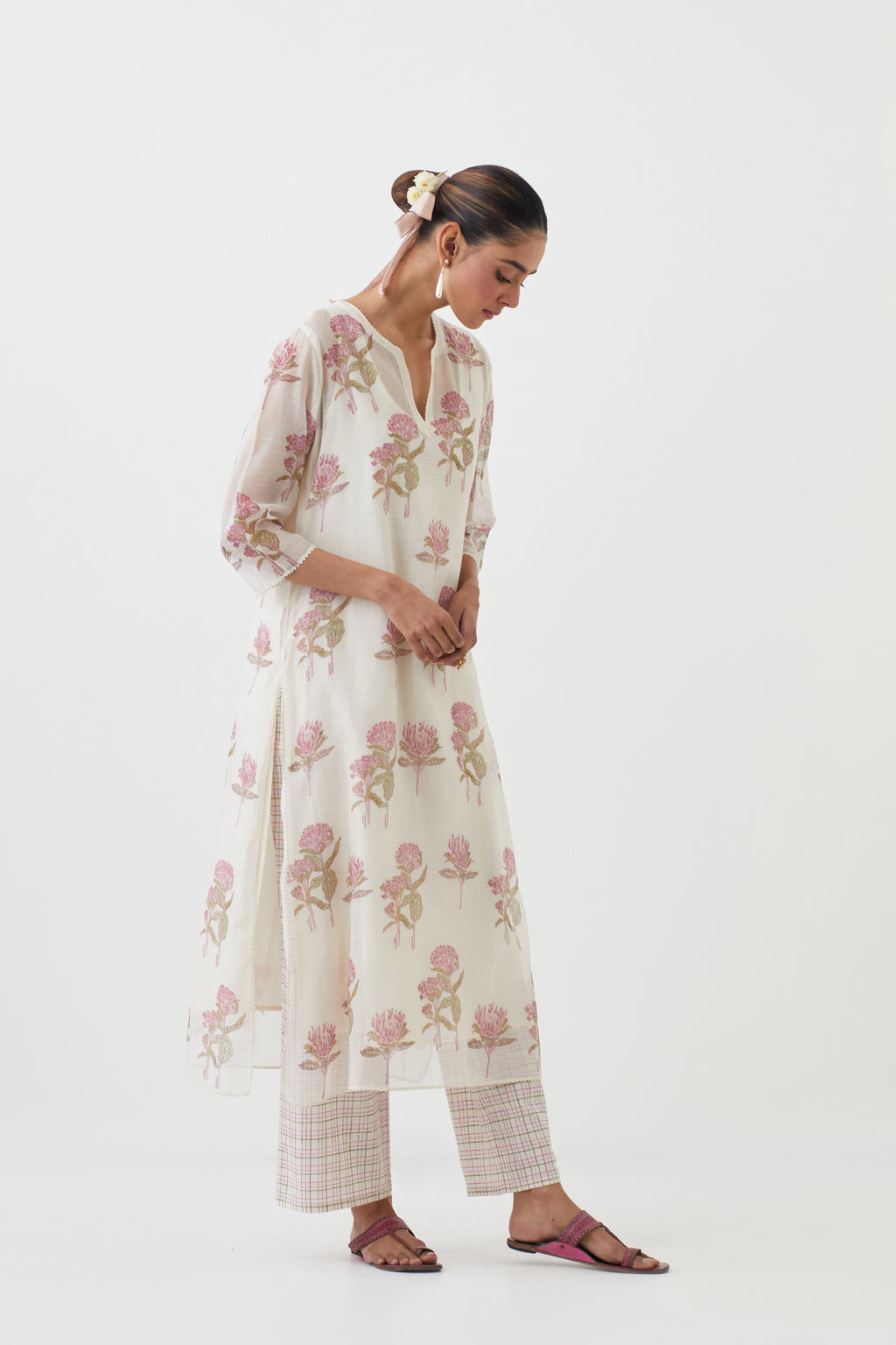 Off white cotton chanderi hand block printed kurta set with all-over pink colored flower.