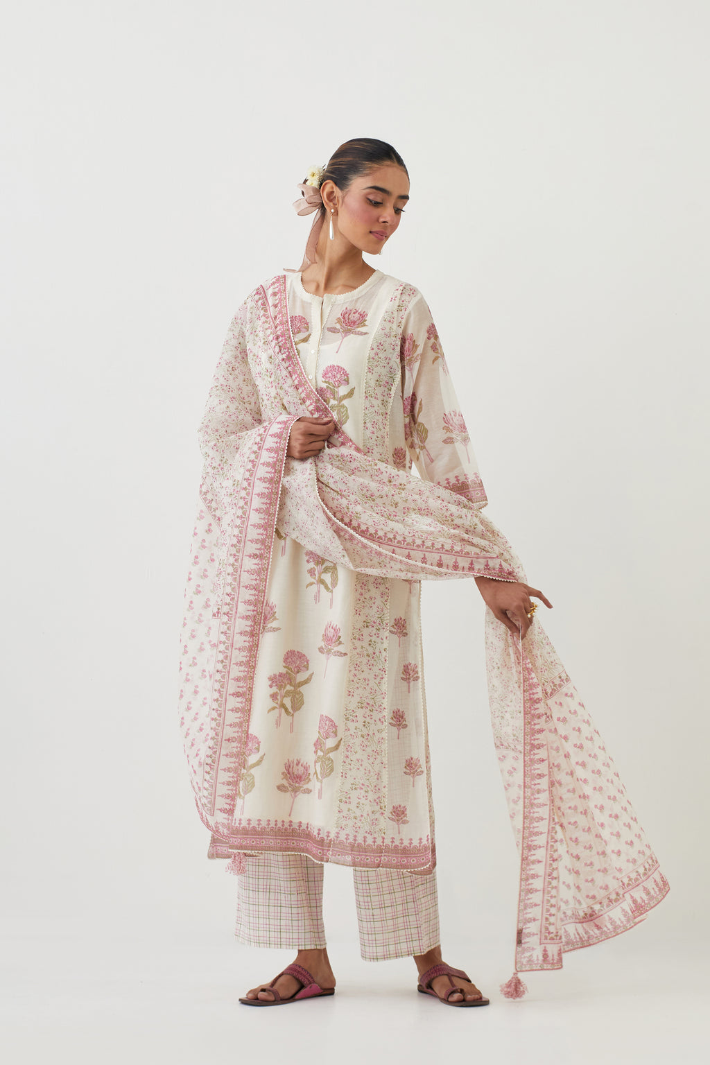 Off white cotton chanderi hand-block printed kurta set with multi-print panels, highlighted with off white ricrac.