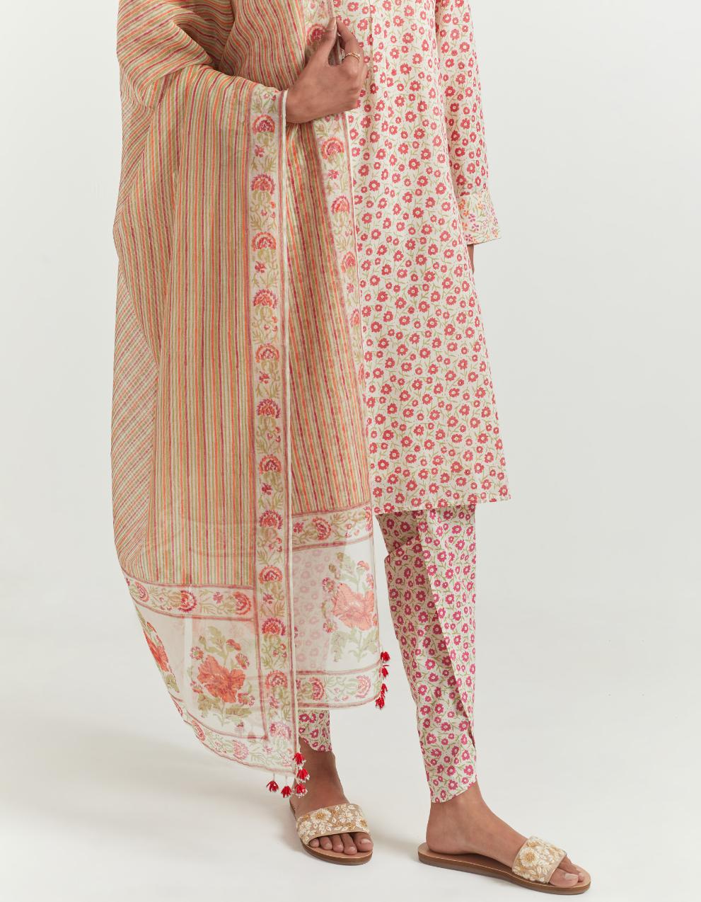 Cotton straight short kurta set with all-over orange ditsy flower hand block print and round hem.