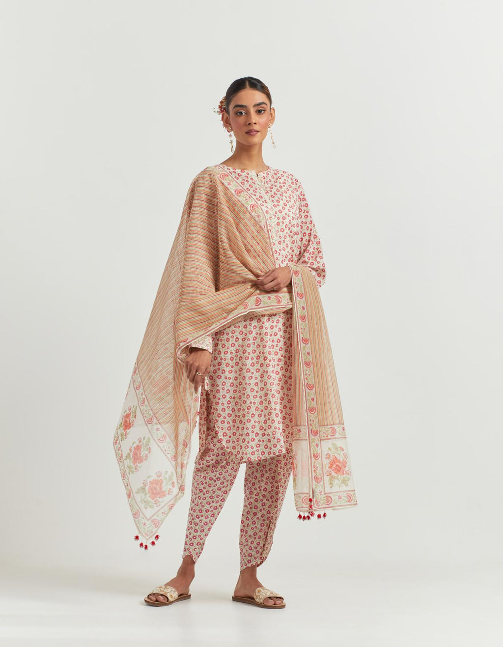 Cotton straight short kurta set with all-over orange ditsy flower hand block print and round hem.
