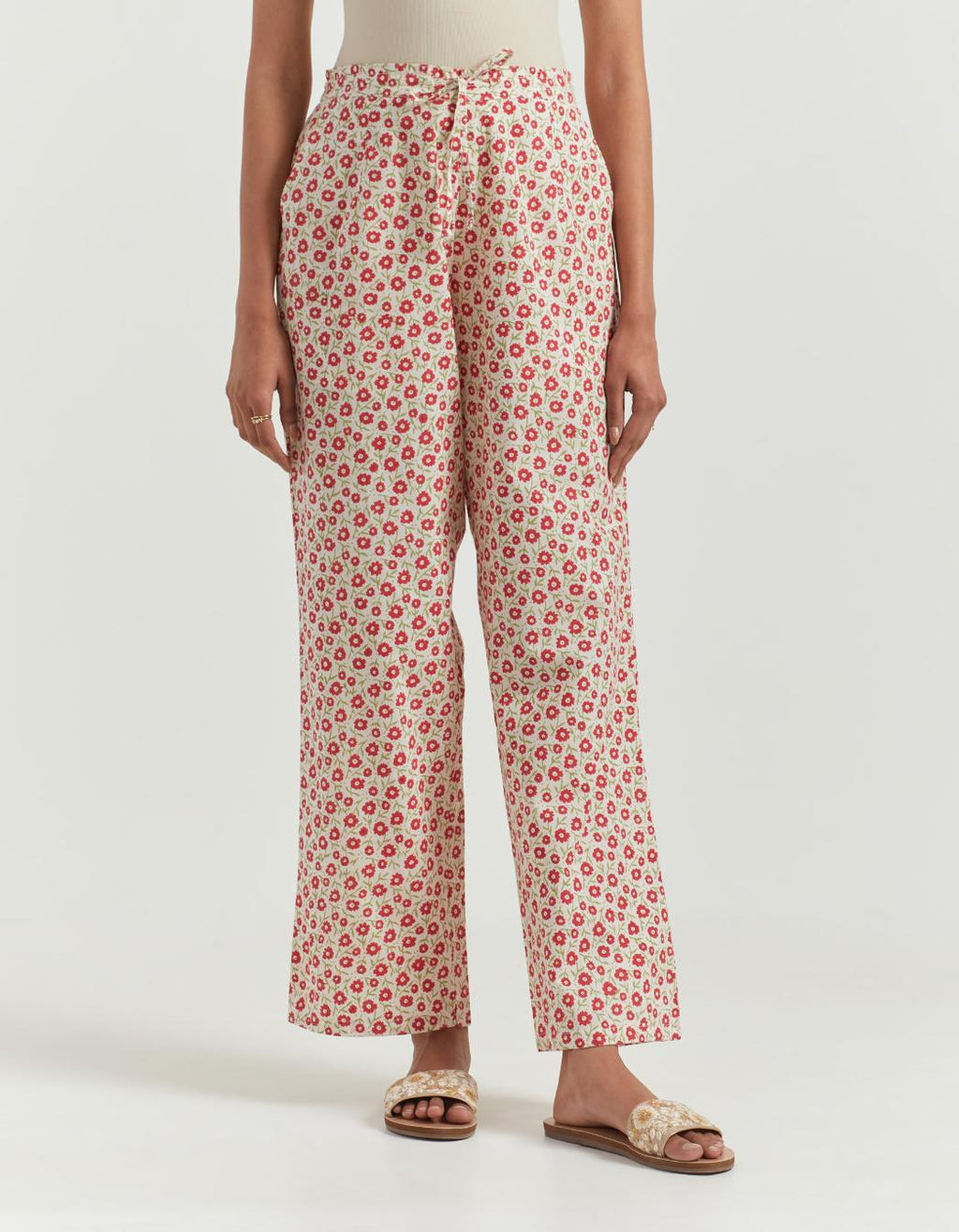 Red & green cotton straight pants with all-over small flower hand block print.