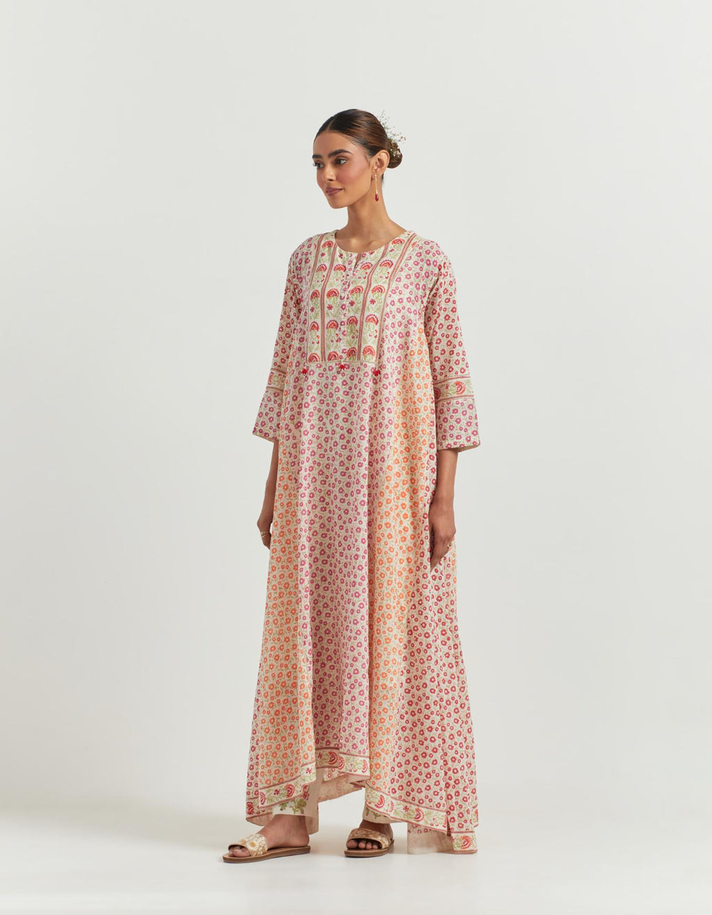Multi colored A-line long kurta set with all-over hand block print and beaded tassels.