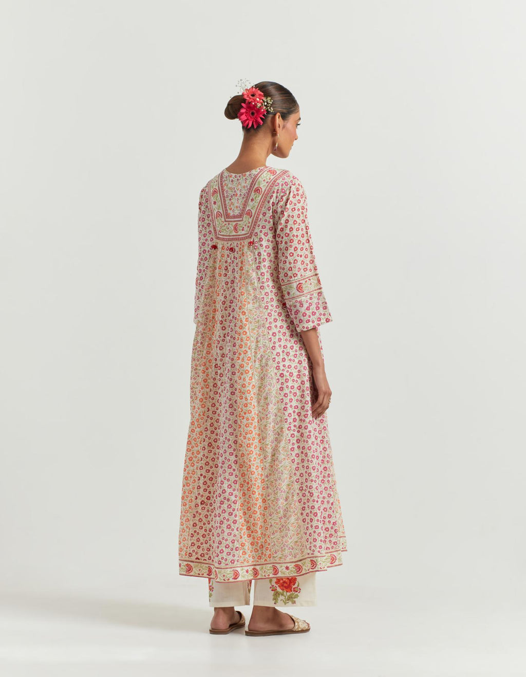 Multi colored hand blcok printed cotton kurta dress set with a V neck, yoke and panels.