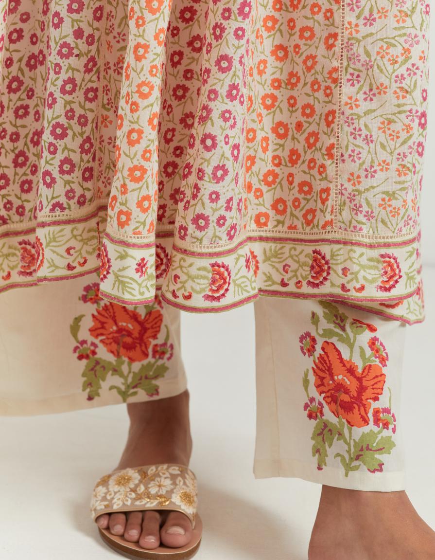 Multi colored hand blcok printed cotton kurta dress set with a V neck, yoke and panels.