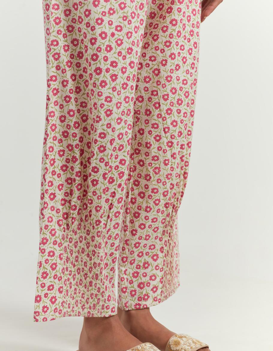 Red and green hand block printed straight pants detailed with pintucks at bottom.