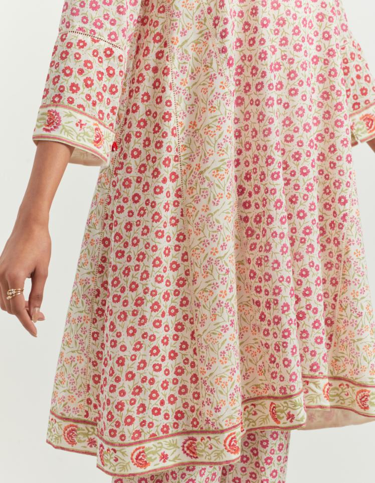 Multi colored hand block printed short kalidar cotton kurta set, detailed with off white ladder lace.