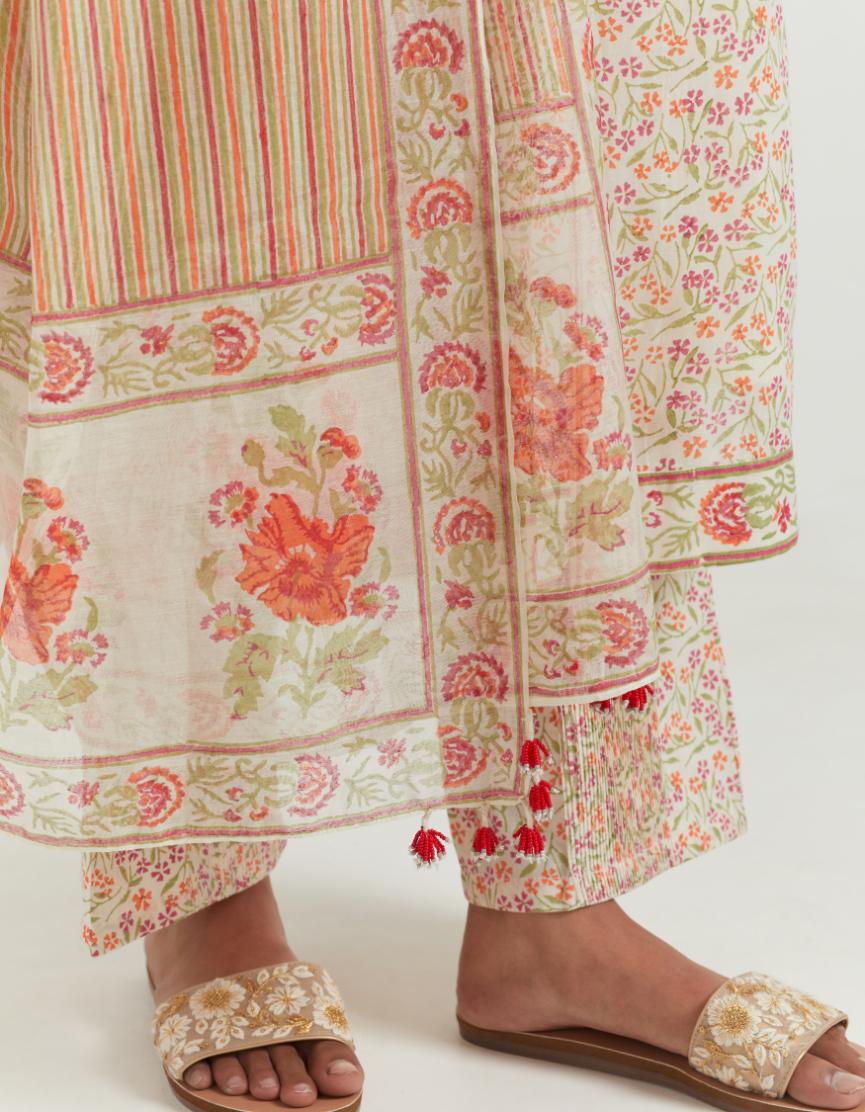Multi colored hand block printed cotton straight kurta set highlighted with pin tucks at yoke.