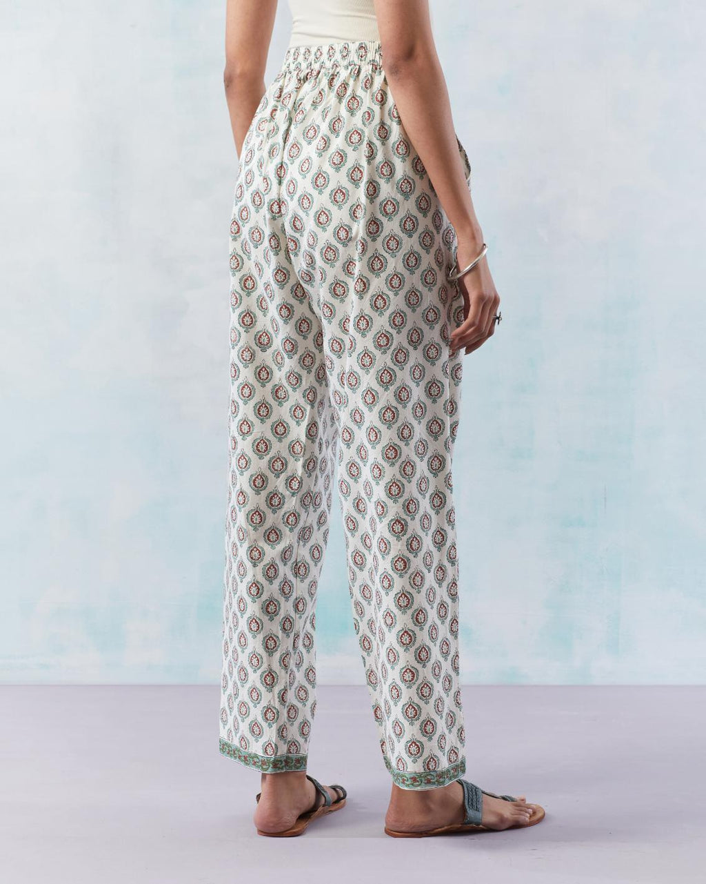 Off white cotton straight pants with all-over small booti hand block print.