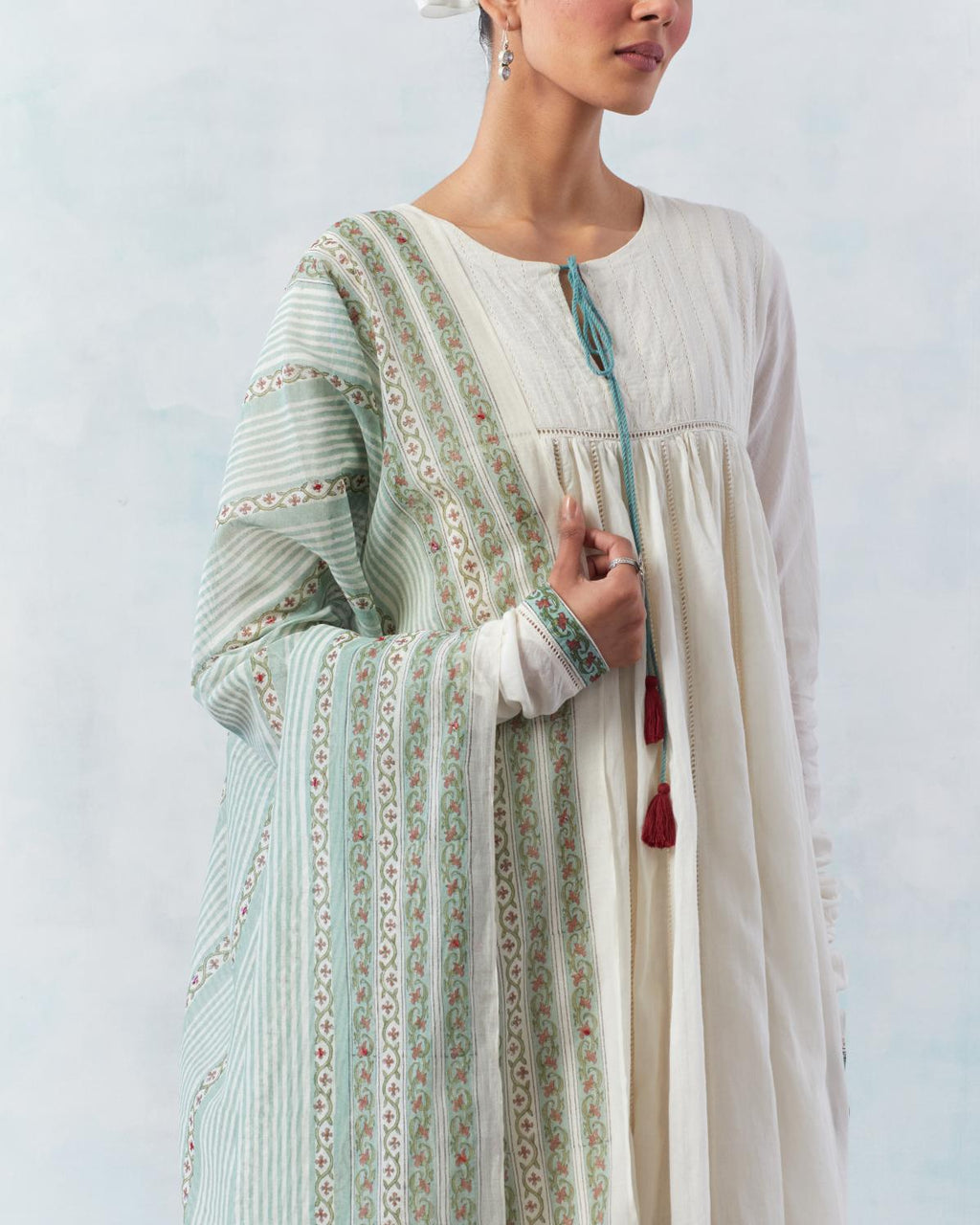 Teal green cotton Chanderi dupatta with all-over hand block print.