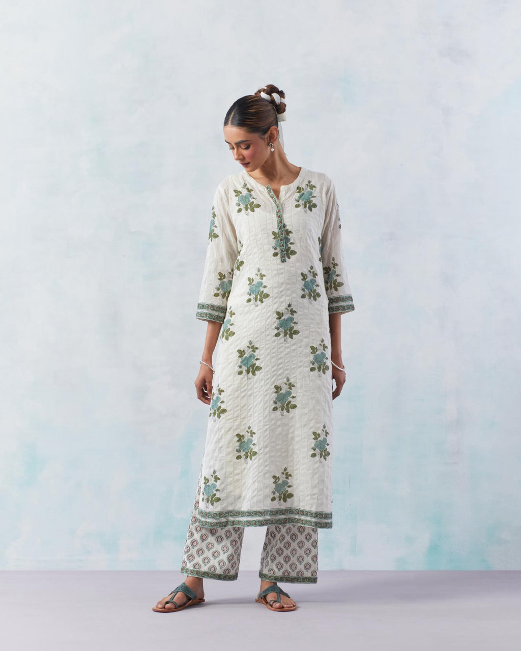 Off white cotton hand block printed straight kurta set with all-over teal green flower boota and faggoting detailing.