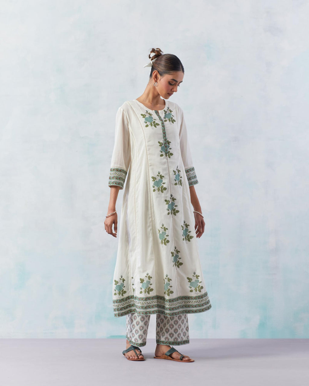 Off white cotton hand block printed A-line kurta set with teal green flower boota and faggoting detailing.