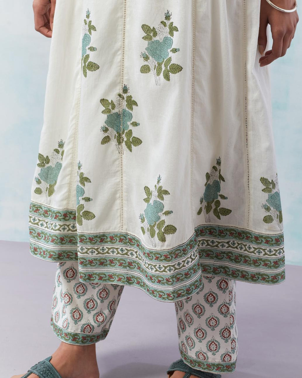 Off white cotton hand block printed A-line kurta set with teal green flower boota and faggoting detailing.