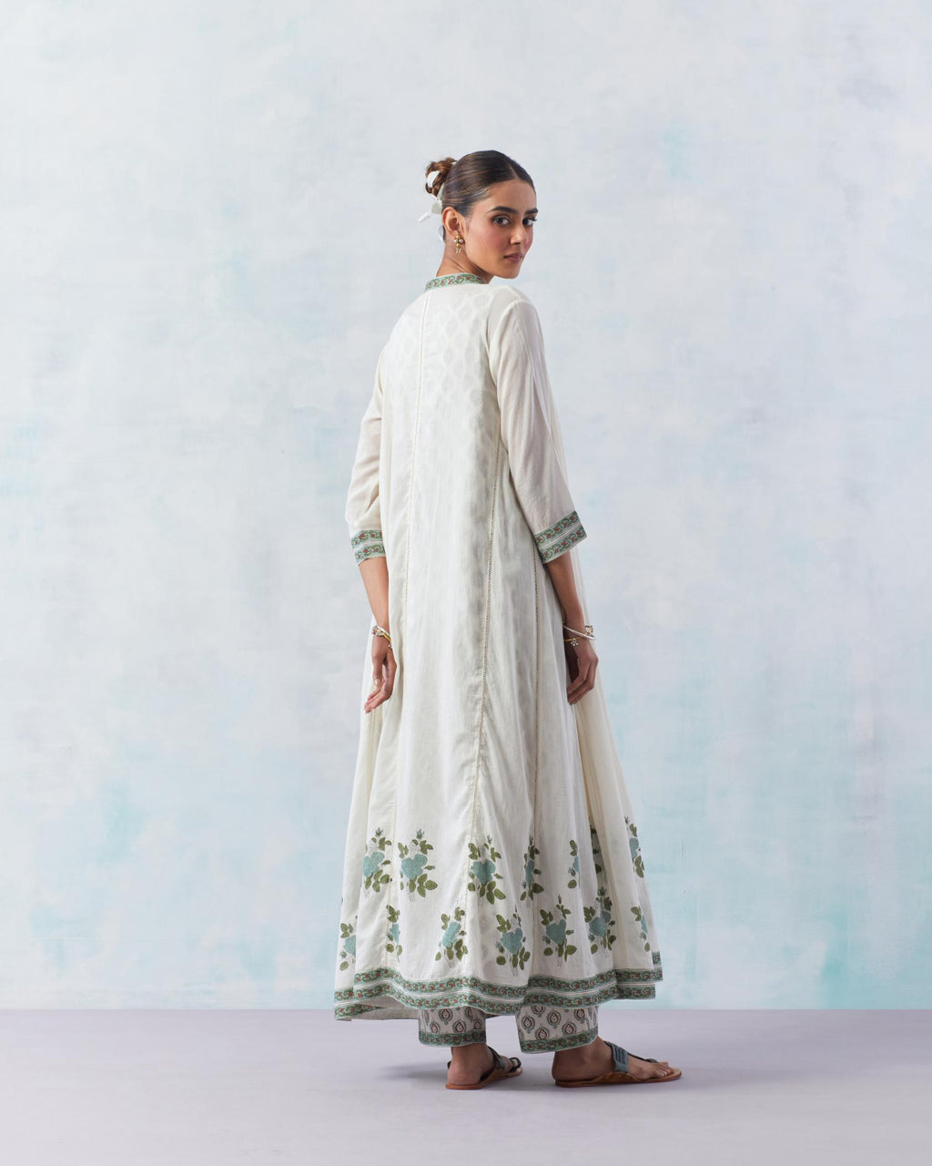 Off white hand block printed angrakha kurta set with printed slip inside and panels are attached with ladder lace.