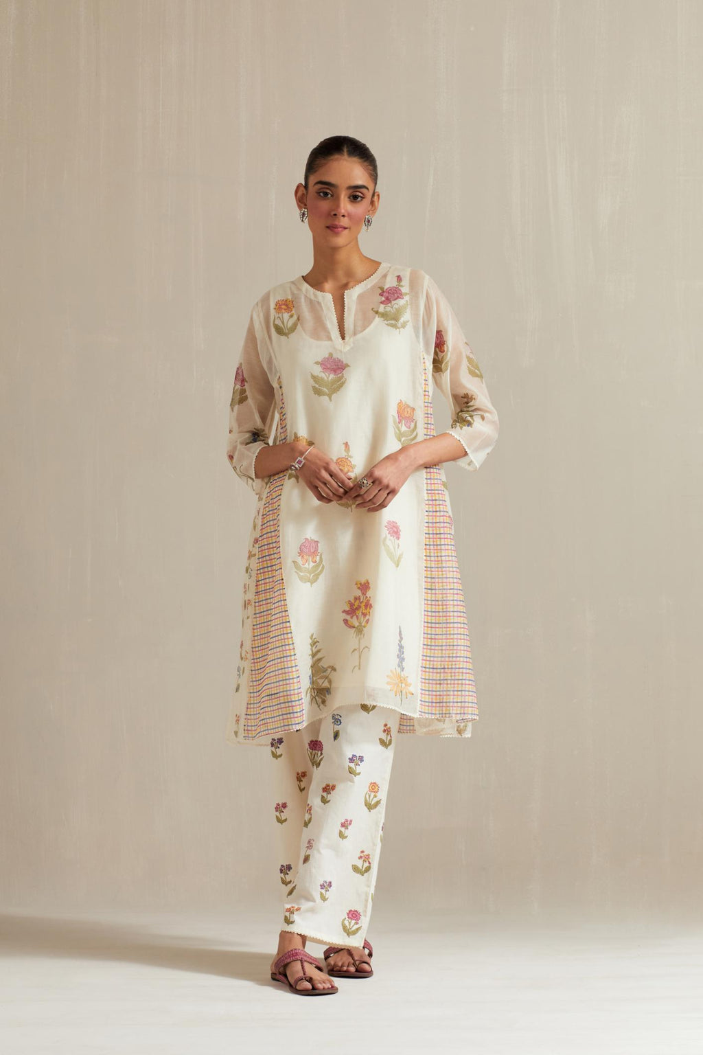 Off white hand block printed cotton chanderi short kalidar kurta set with all-over multi colored flower.