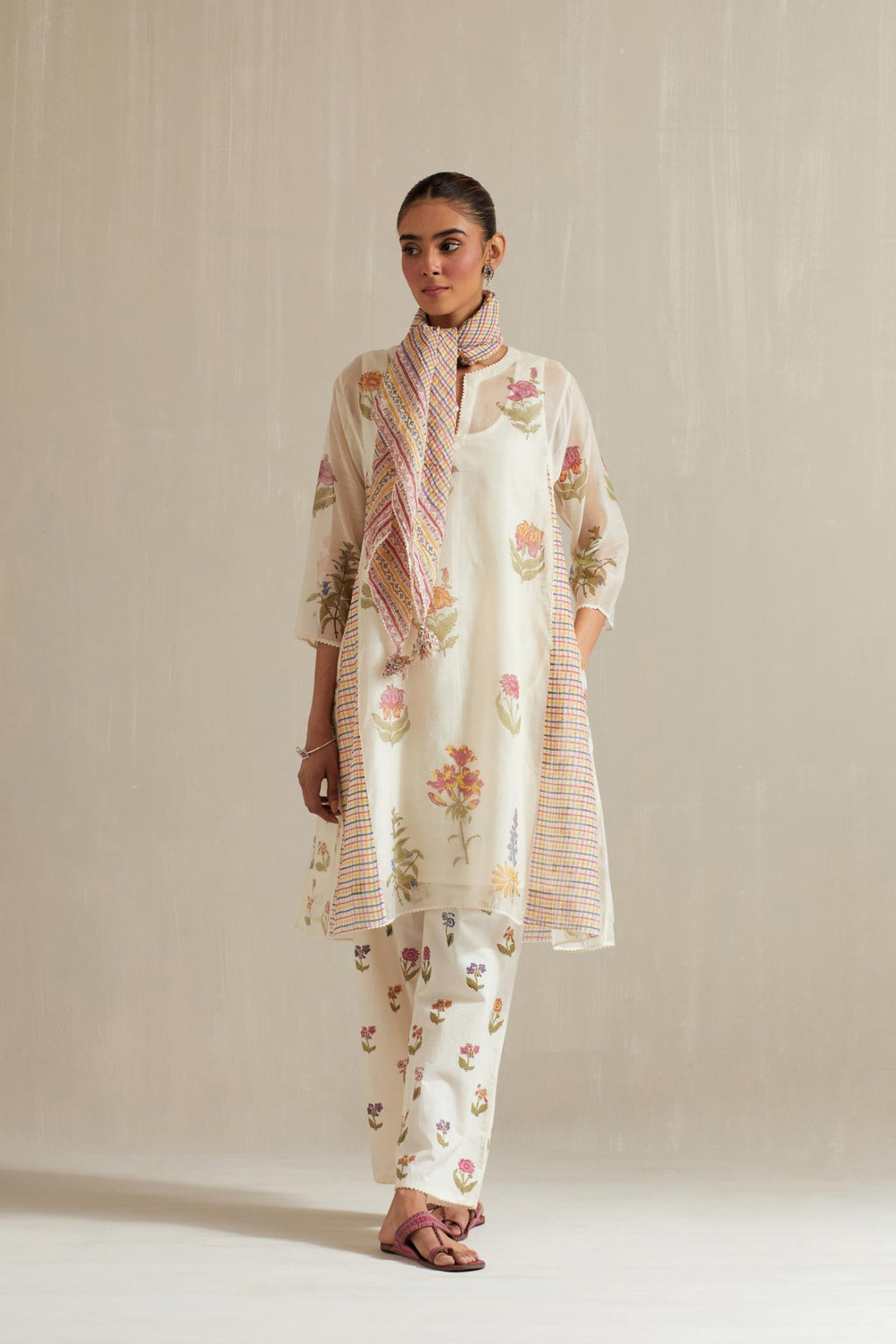 Off white hand block printed cotton chanderi short kalidar kurta set with all-over multi colored flower.