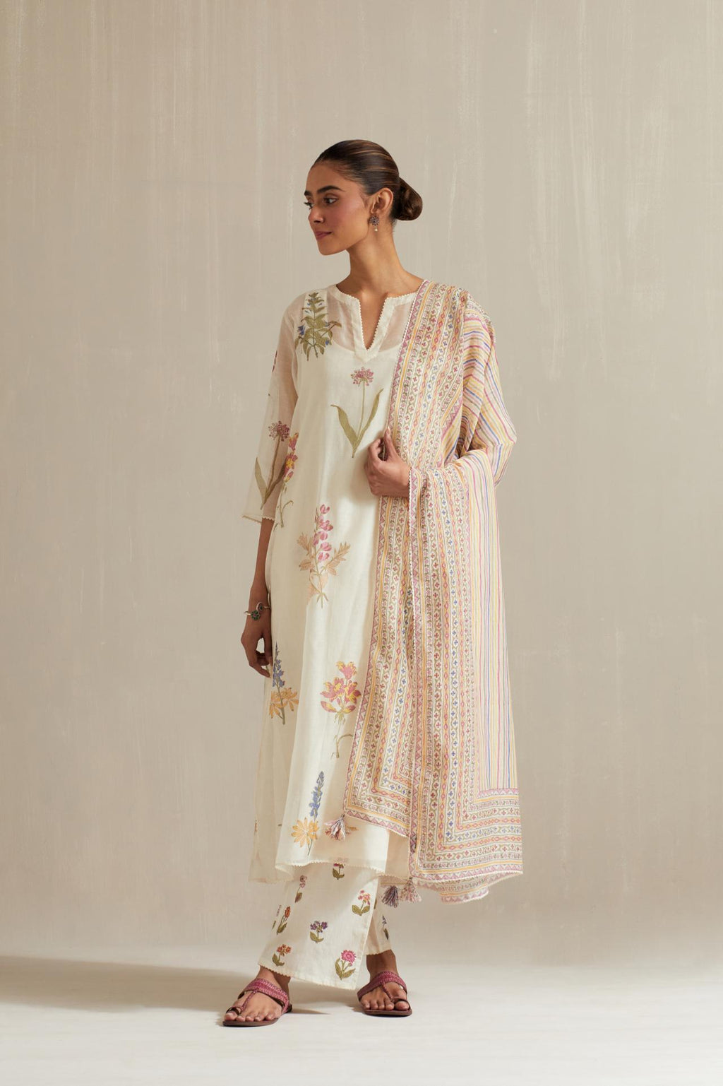 Off white cotton chanderi hand block printed kurta set with all-over multi colored flower.
