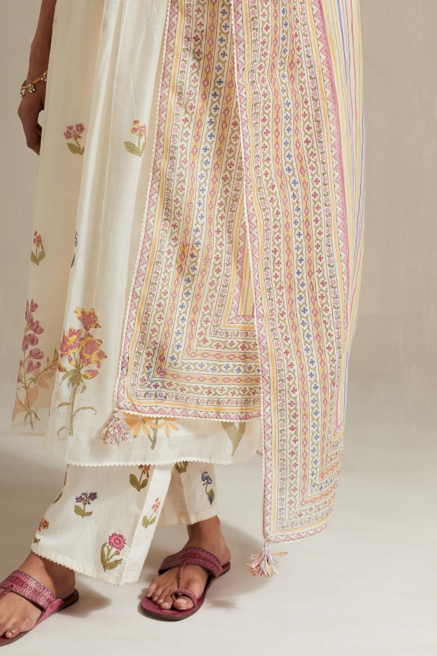 Off white cotton chanderi hand block printed straight kurta set with pin tucks at yoke and all-over multi colored flower.