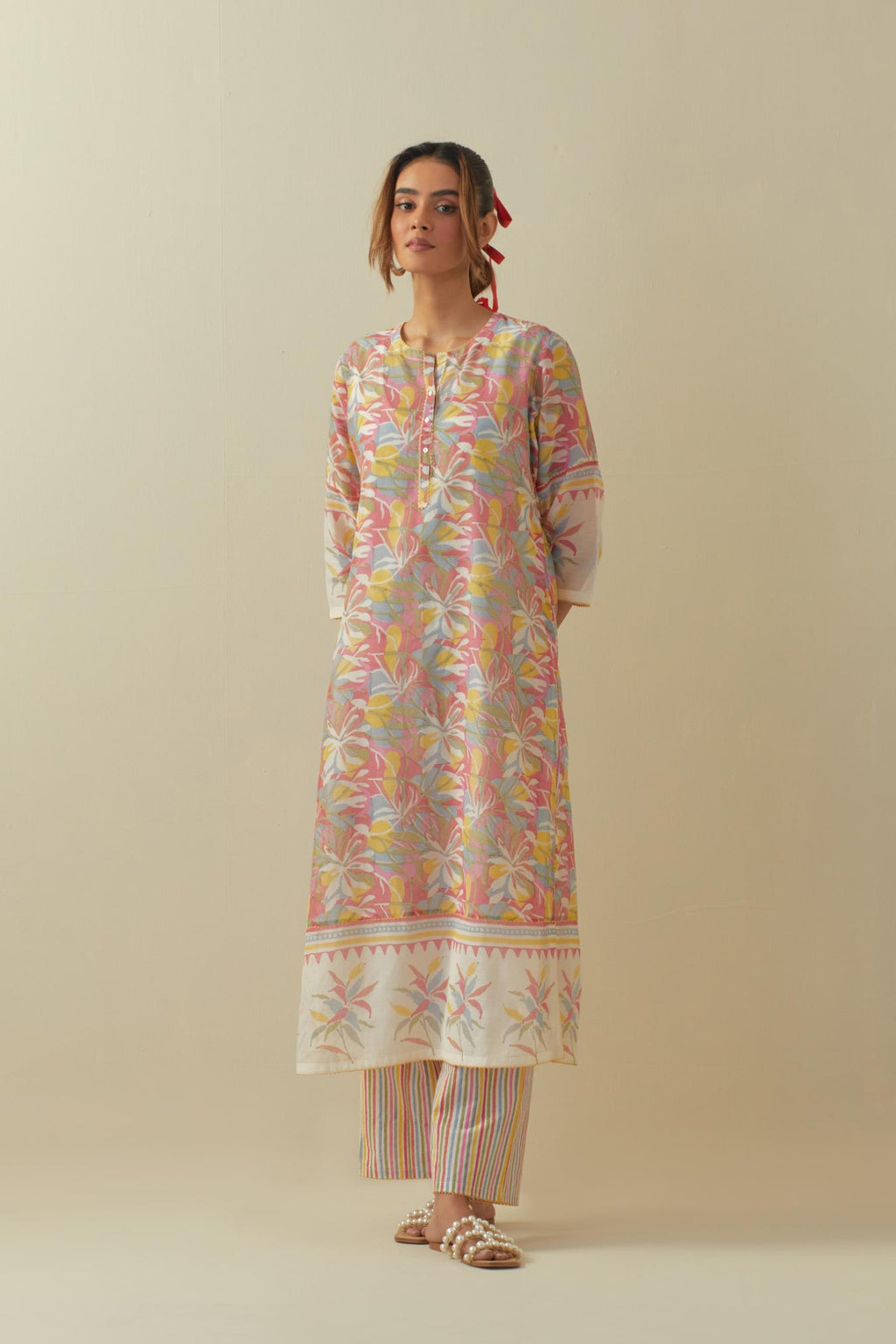 Off white cotton chanderi hand block printed kurta set with multi colored flower and border detail at hem.
