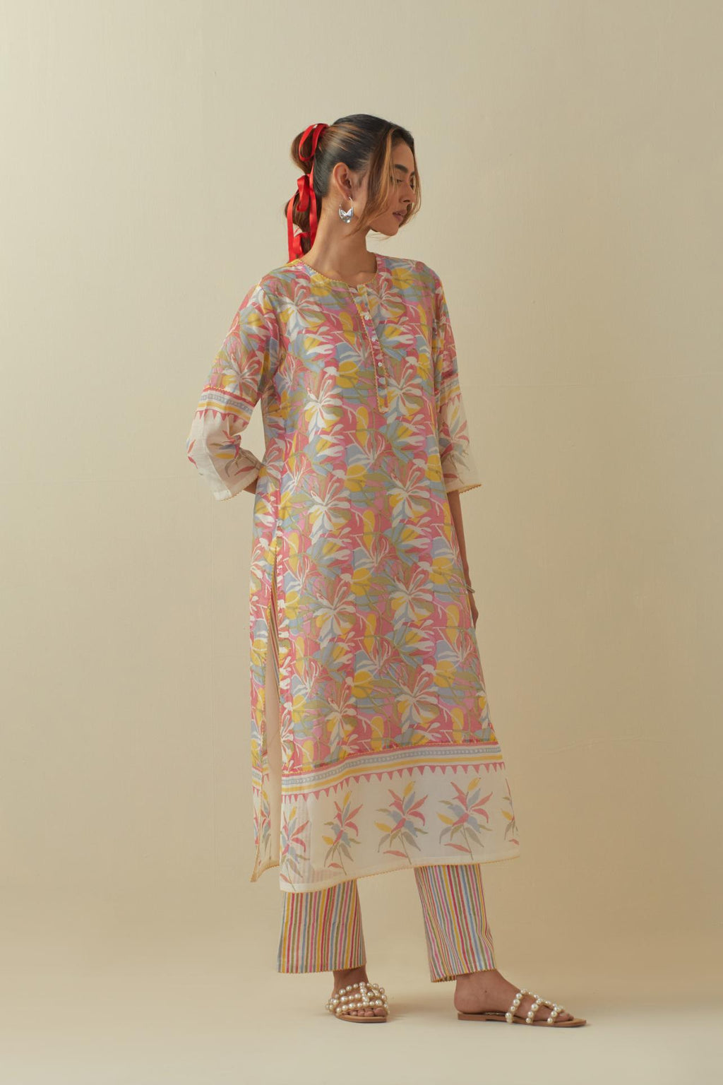 Off white cotton chanderi hand block printed kurta set with multi colored flower and border detail at hem.