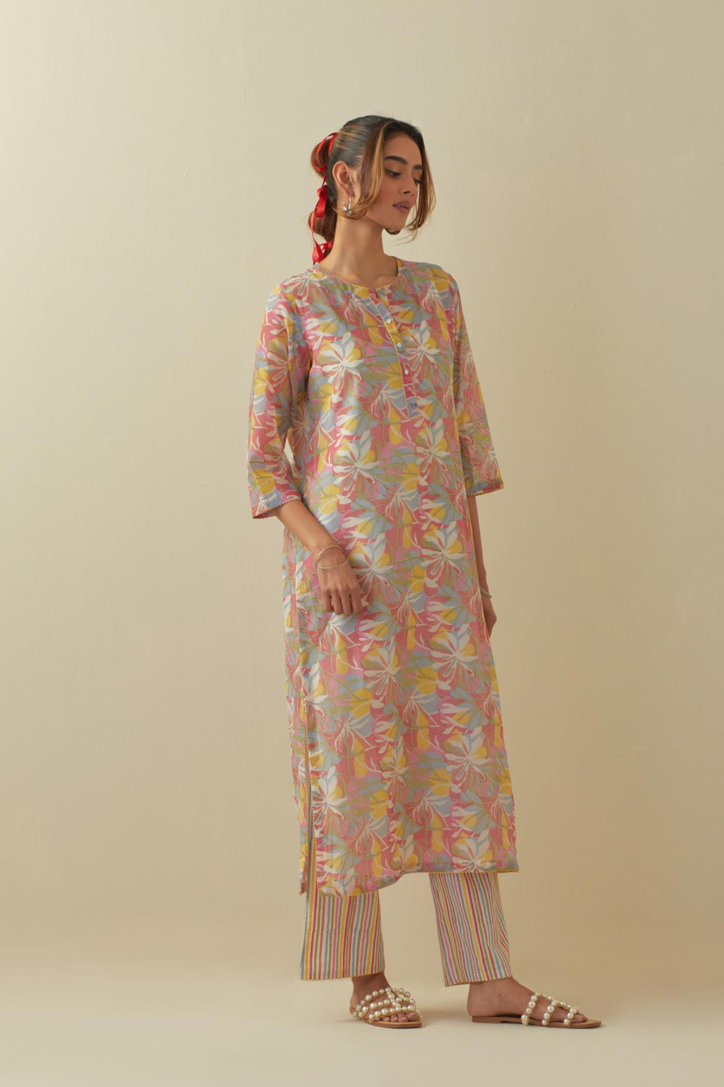 Off white cotton chanderi hand block printed kurta set with all-over multi colored flower.