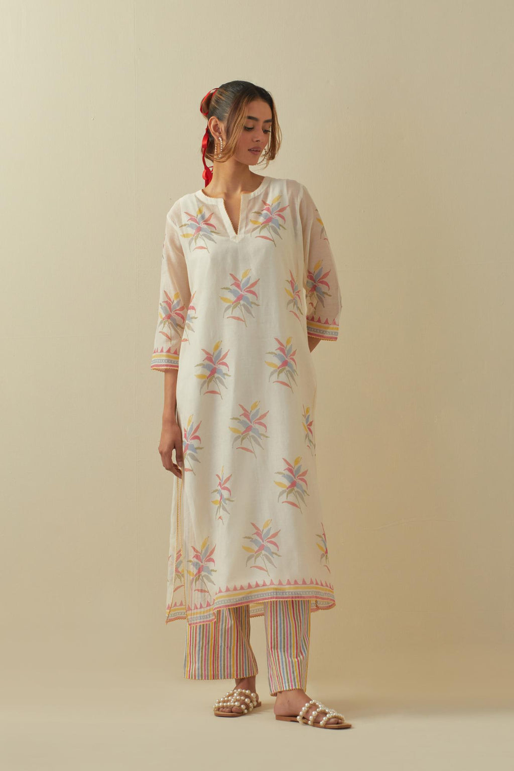 Off white cotton chanderi hand block printed kurta set with all-over multi colored flower boota.