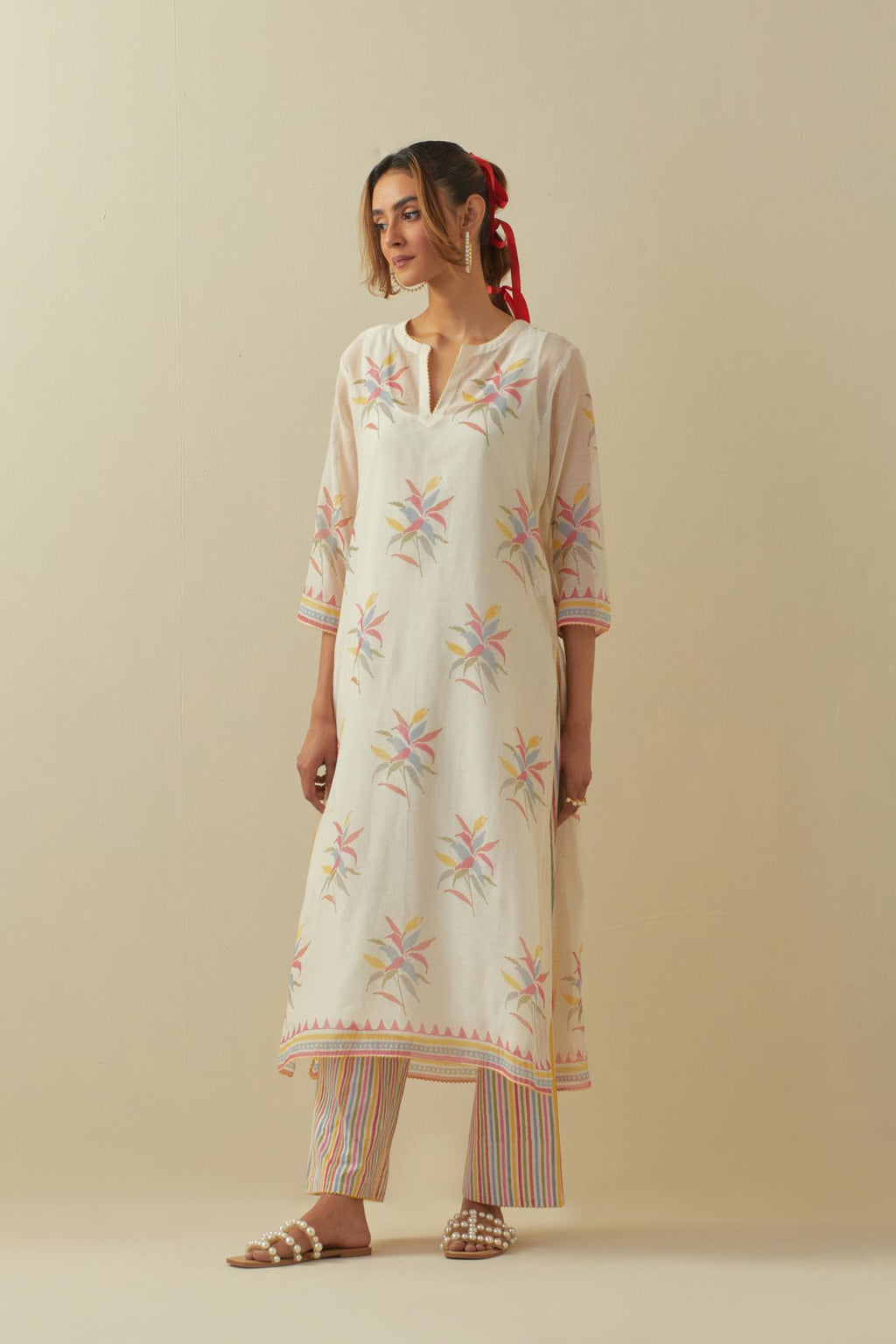 Off white cotton chanderi hand block printed kurta set with all-over multi colored flower boota.