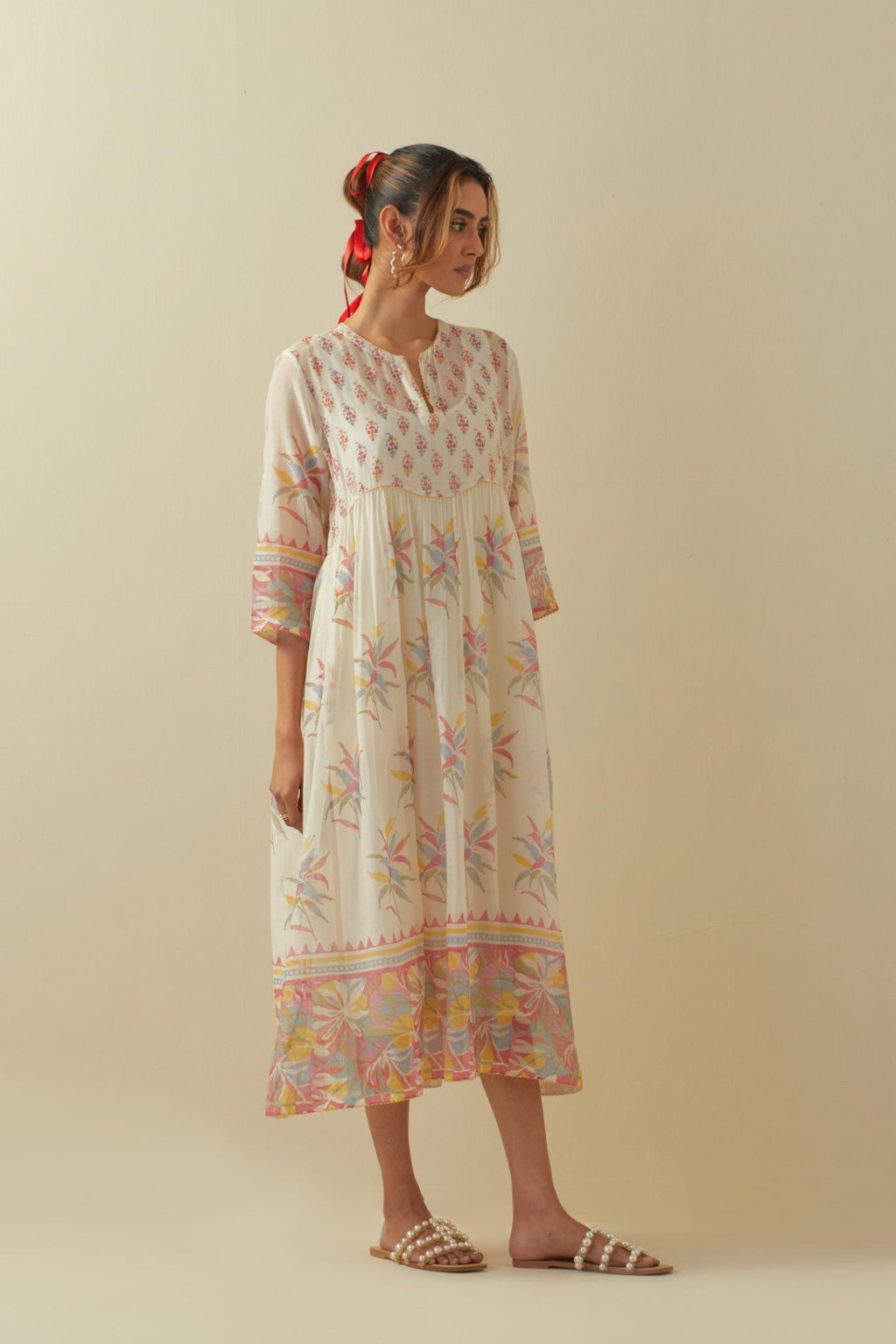 Off white cotton chanderi Kurta dress set with all-over assorted multi colored floral hand block print.