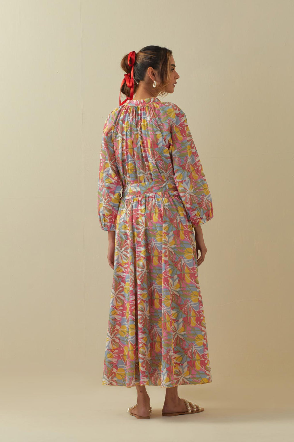 Off white cotton long dress with all-over multi colored floral hand block print.