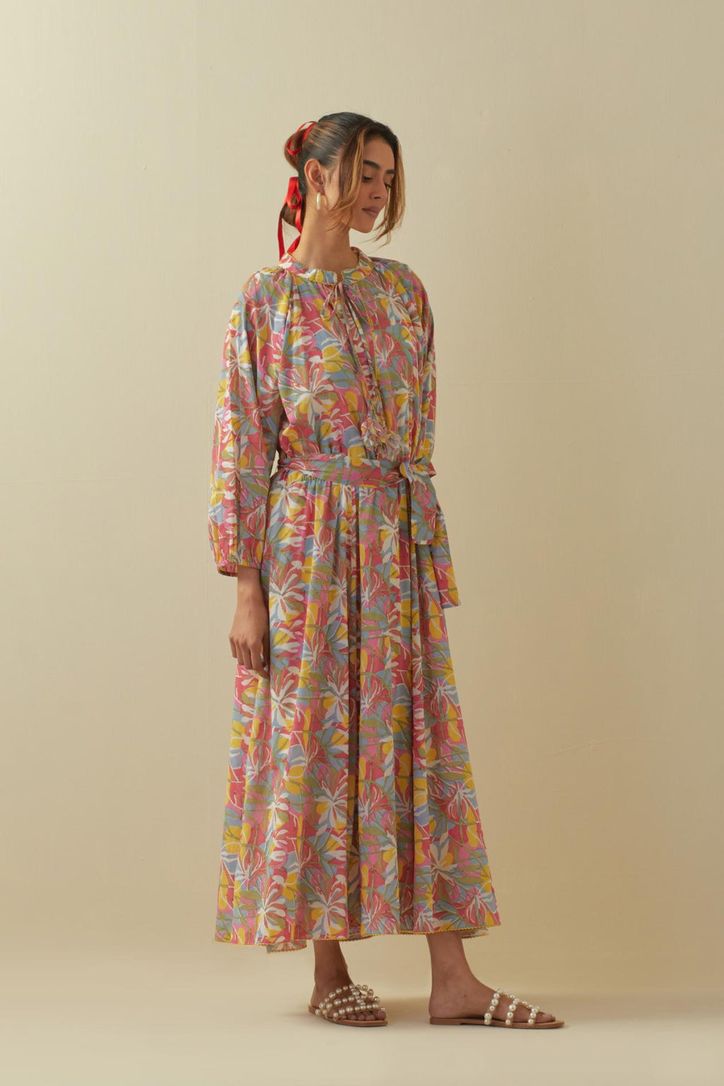 Off white cotton long dress with all-over multi colored floral hand block print.