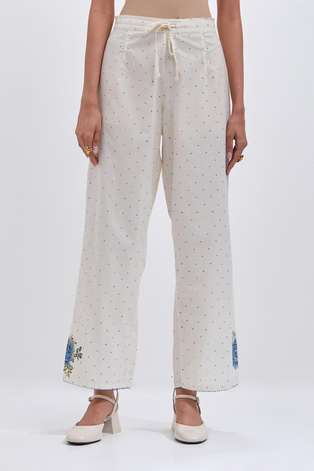 Off white cotton straight pants with all-over blue & green hand block print.