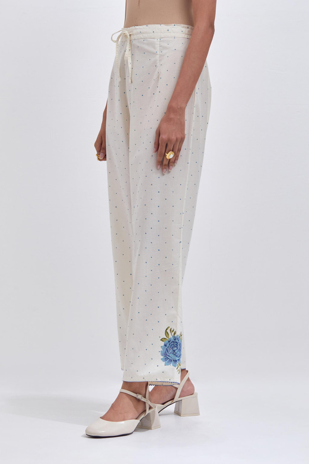 Off white cotton straight pants with all-over blue & green hand block print.
