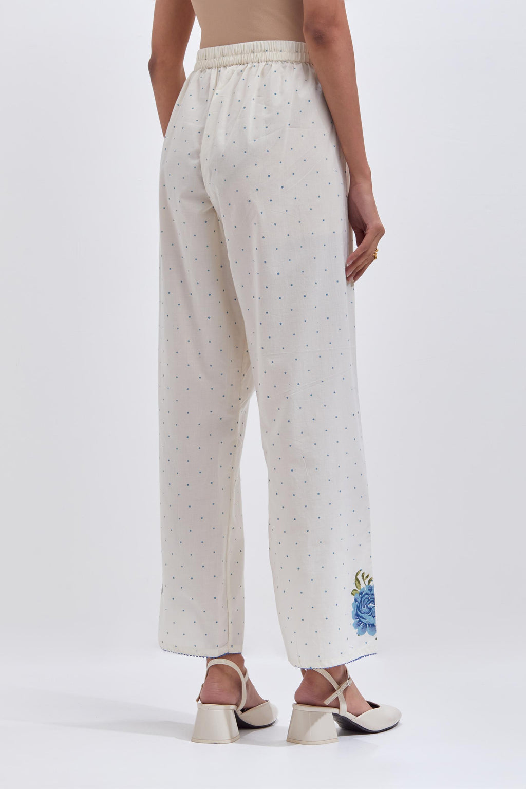 Off white cotton straight pants with all-over blue & green hand block print.