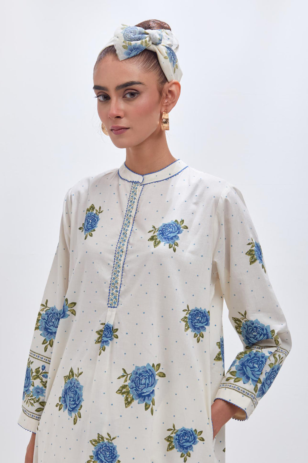 Off white cotton straight short kurta set with all-over blue & green floral hand block print.