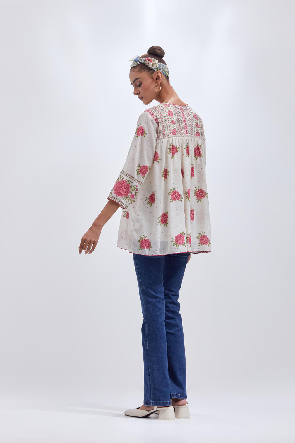 Off white cotton short top with quilted yoke and all-over pink & green floral hand block print.