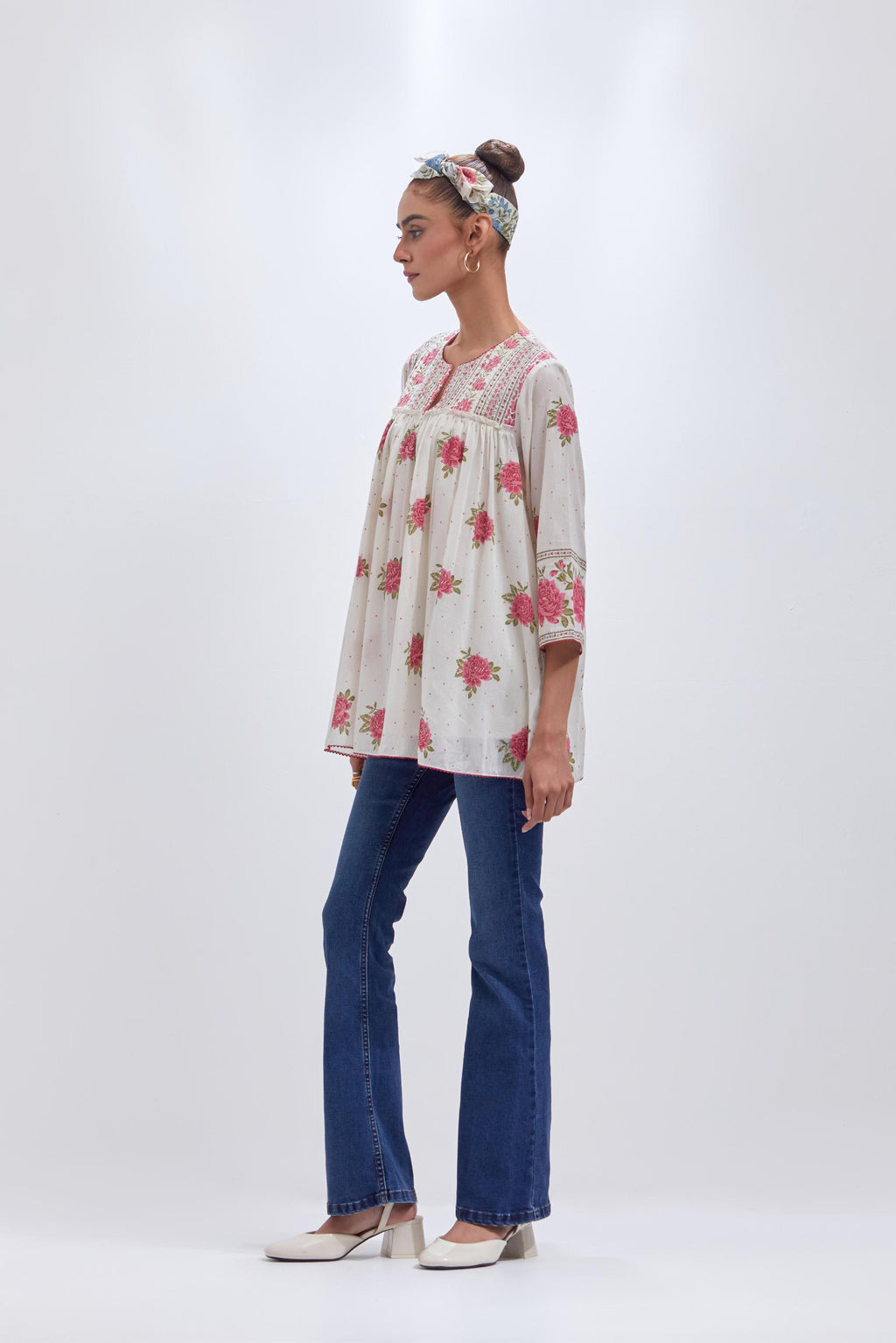 Off white cotton short top with quilted yoke and all-over pink & green floral hand block print.