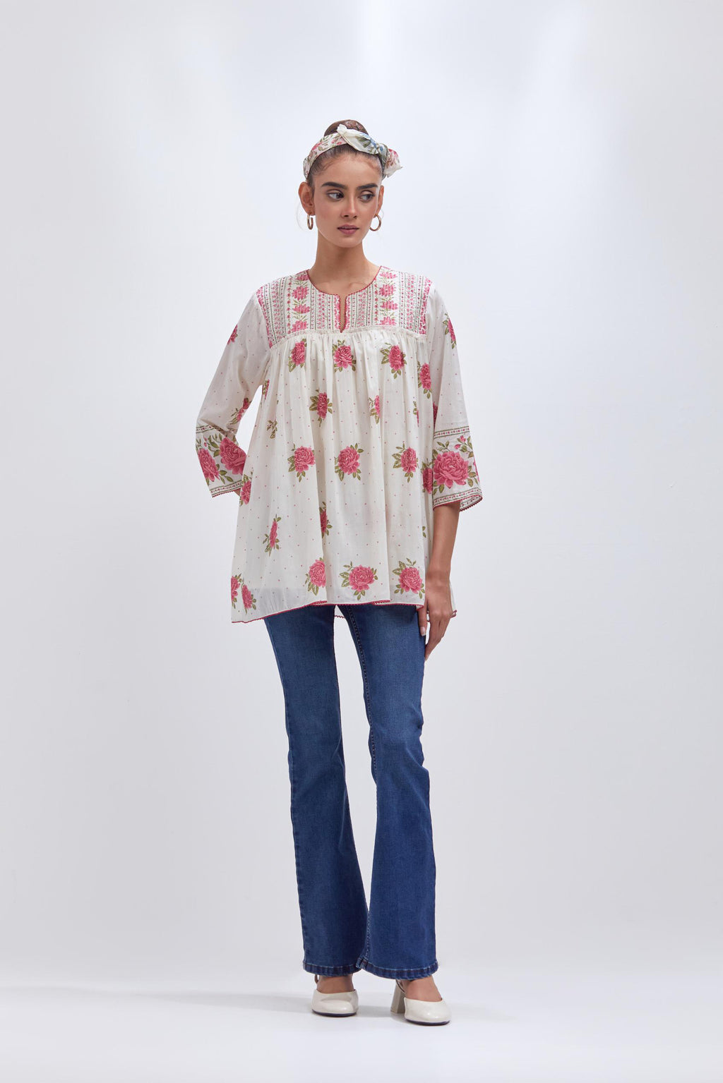 Off white cotton short top with quilted yoke and all-over pink & green floral hand block print.