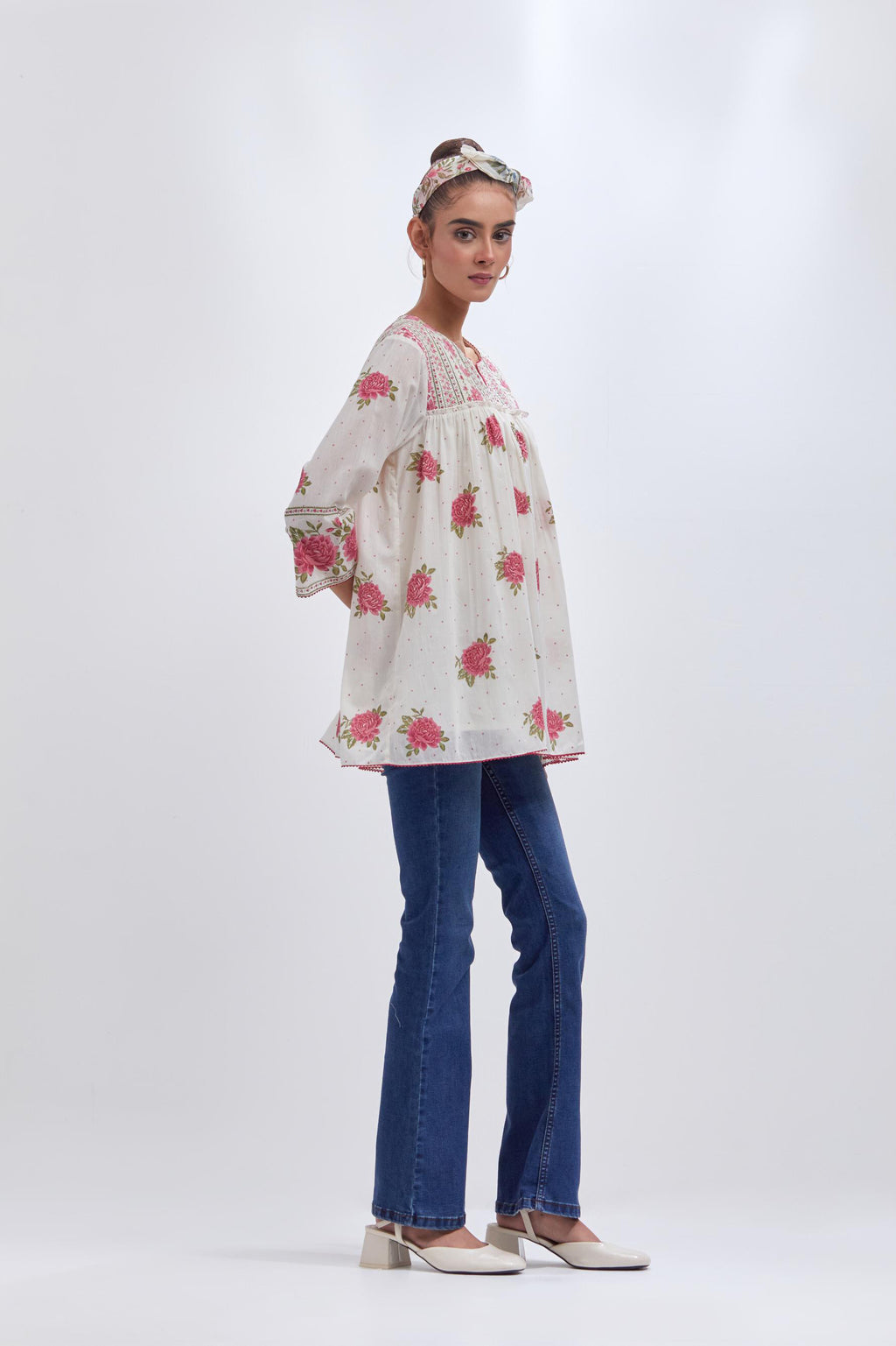 Off white cotton short top with quilted yoke and all-over pink & green floral hand block print.