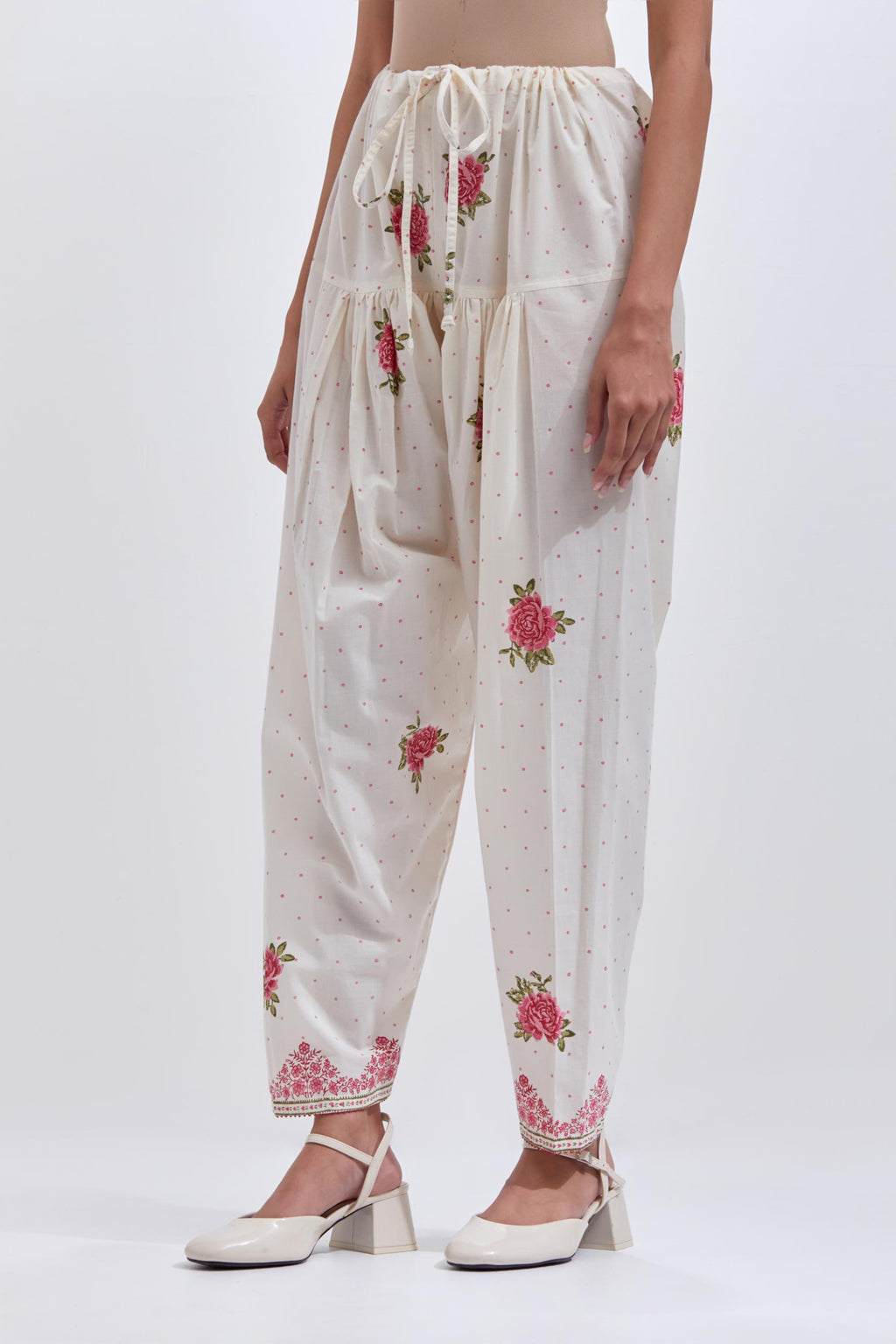 Off white cotton salwar with all-over pink & green floral hand block print.