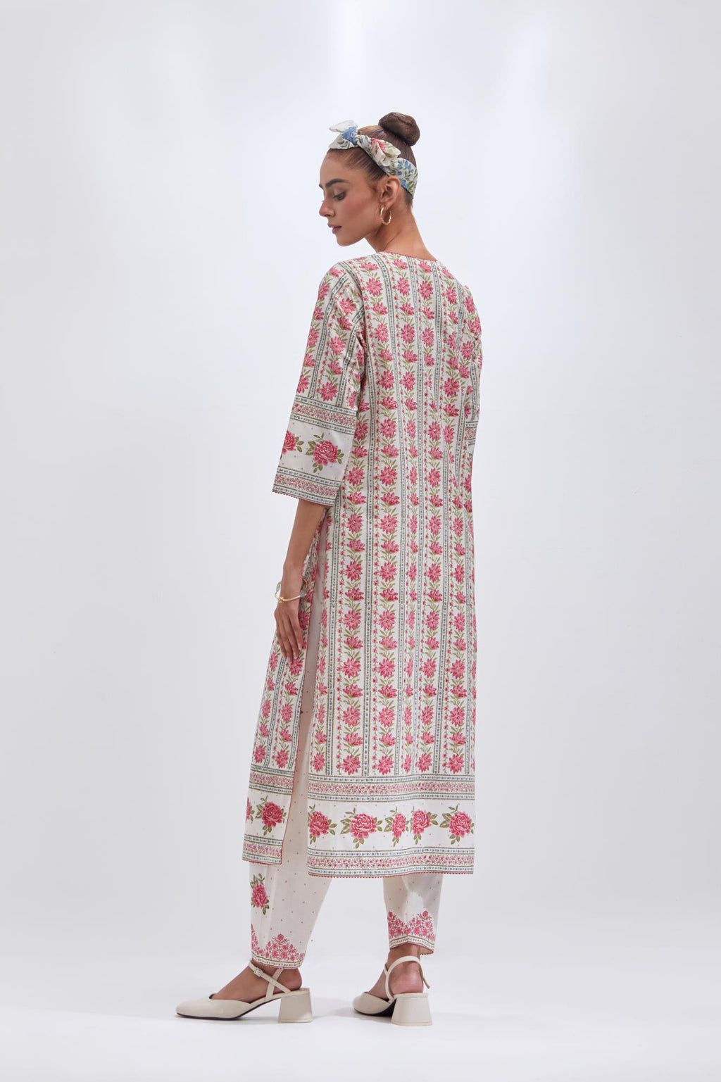 Off white cotton straight kurta set with all-over pink & green floral hand block printed.