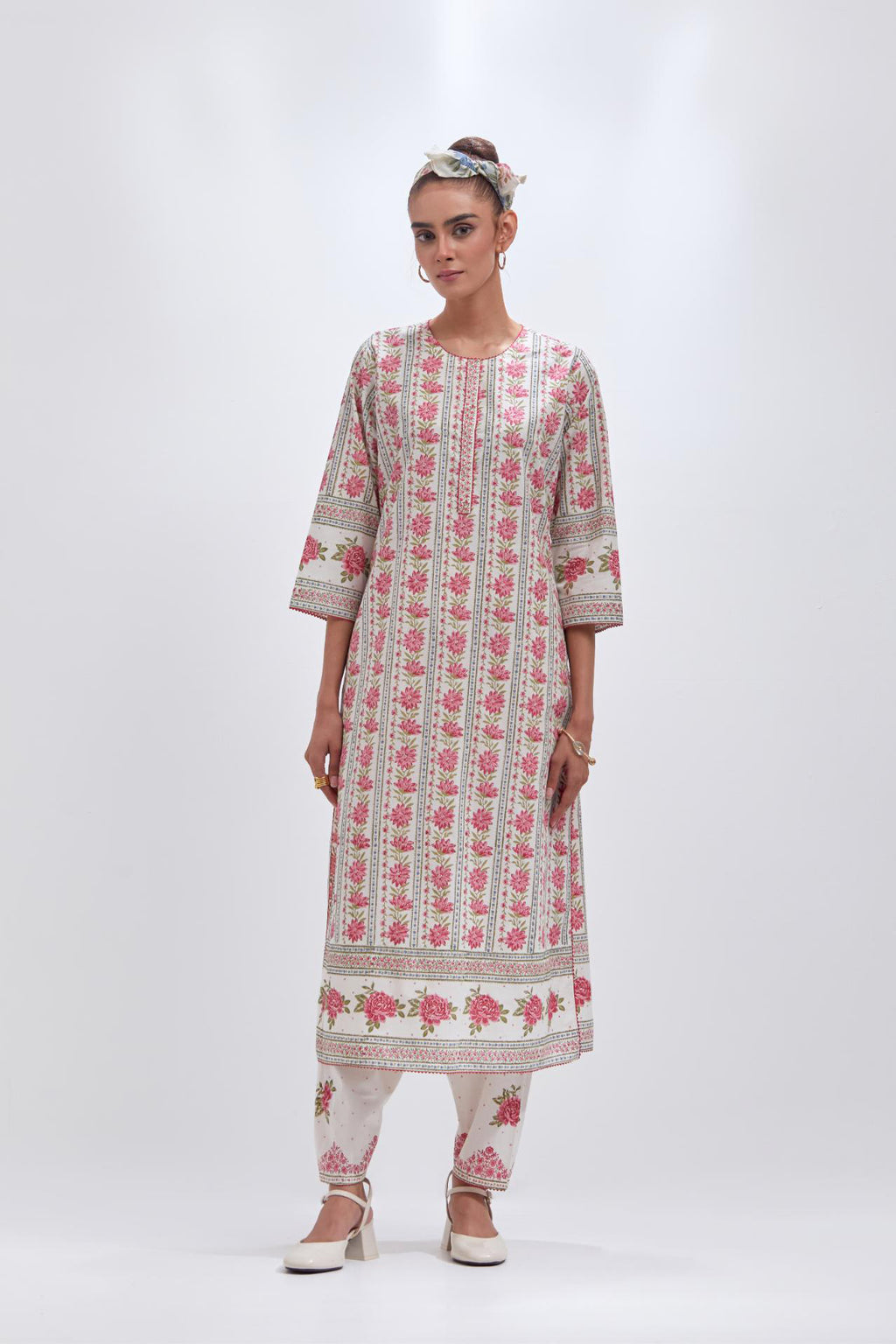 Off white cotton straight kurta set with all-over pink & green floral hand block printed.