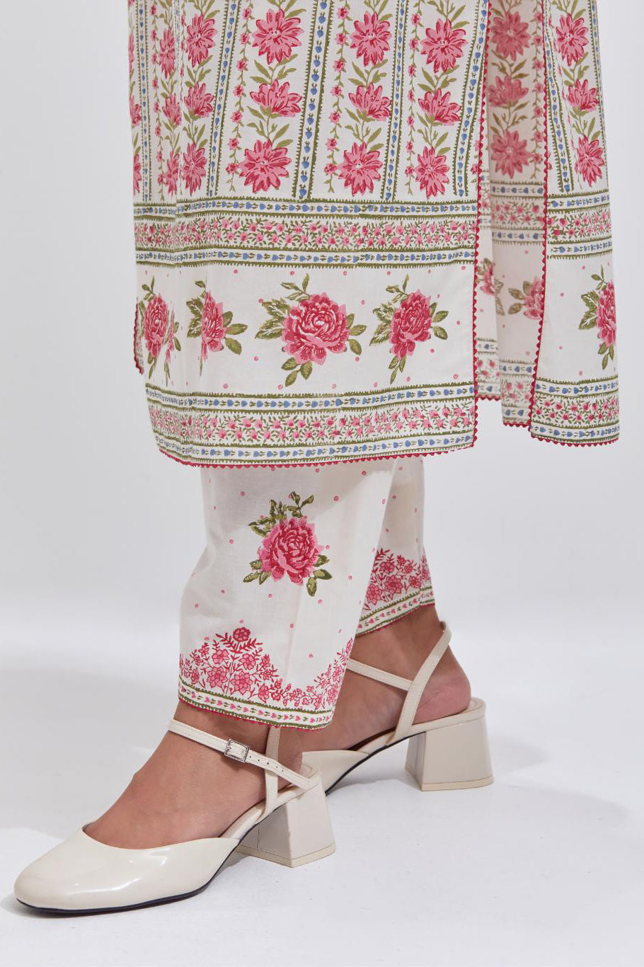 Off white cotton straight kurta set with all-over pink & green floral hand block printed.