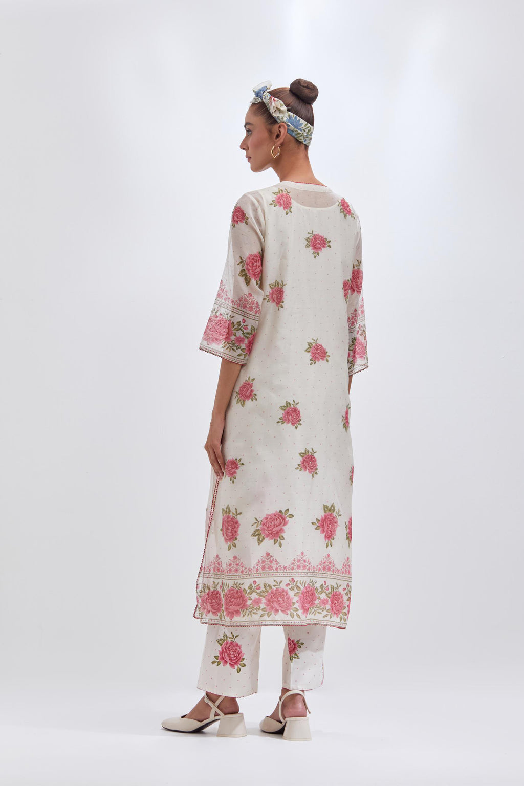 Off white cotton chanderi straight kurta set with all-over pink & green hand block print, highlighted with pin tucks at yoke.