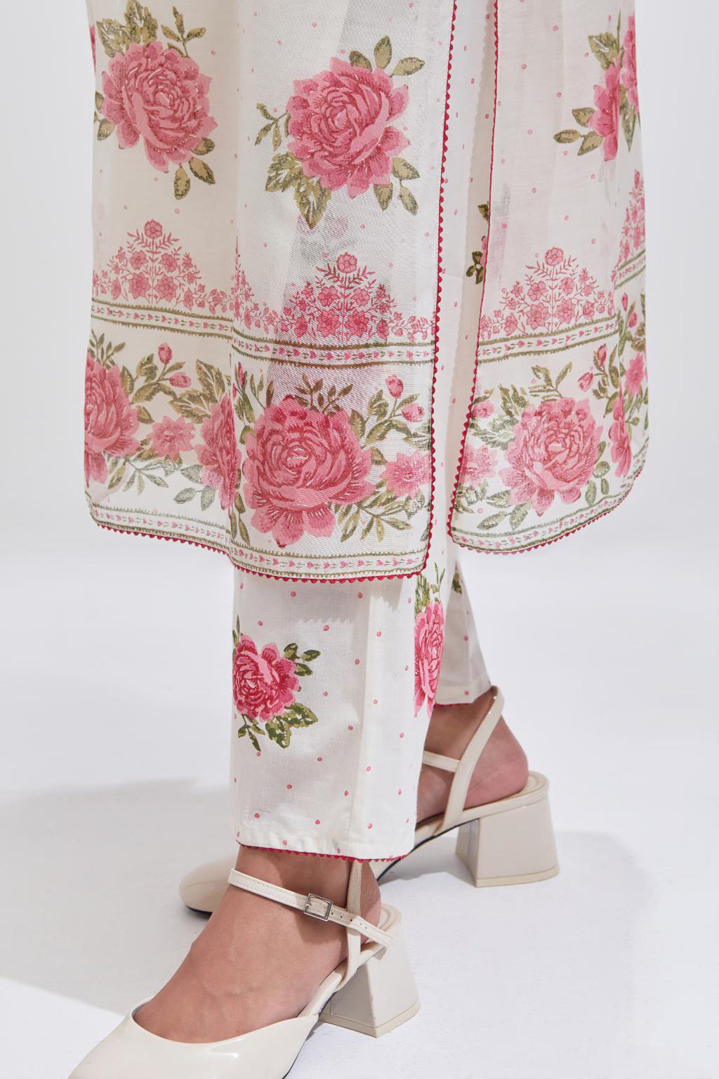 Off white cotton chanderi straight kurta set with all-over pink & green hand block print, highlighted with pin tucks at yoke.