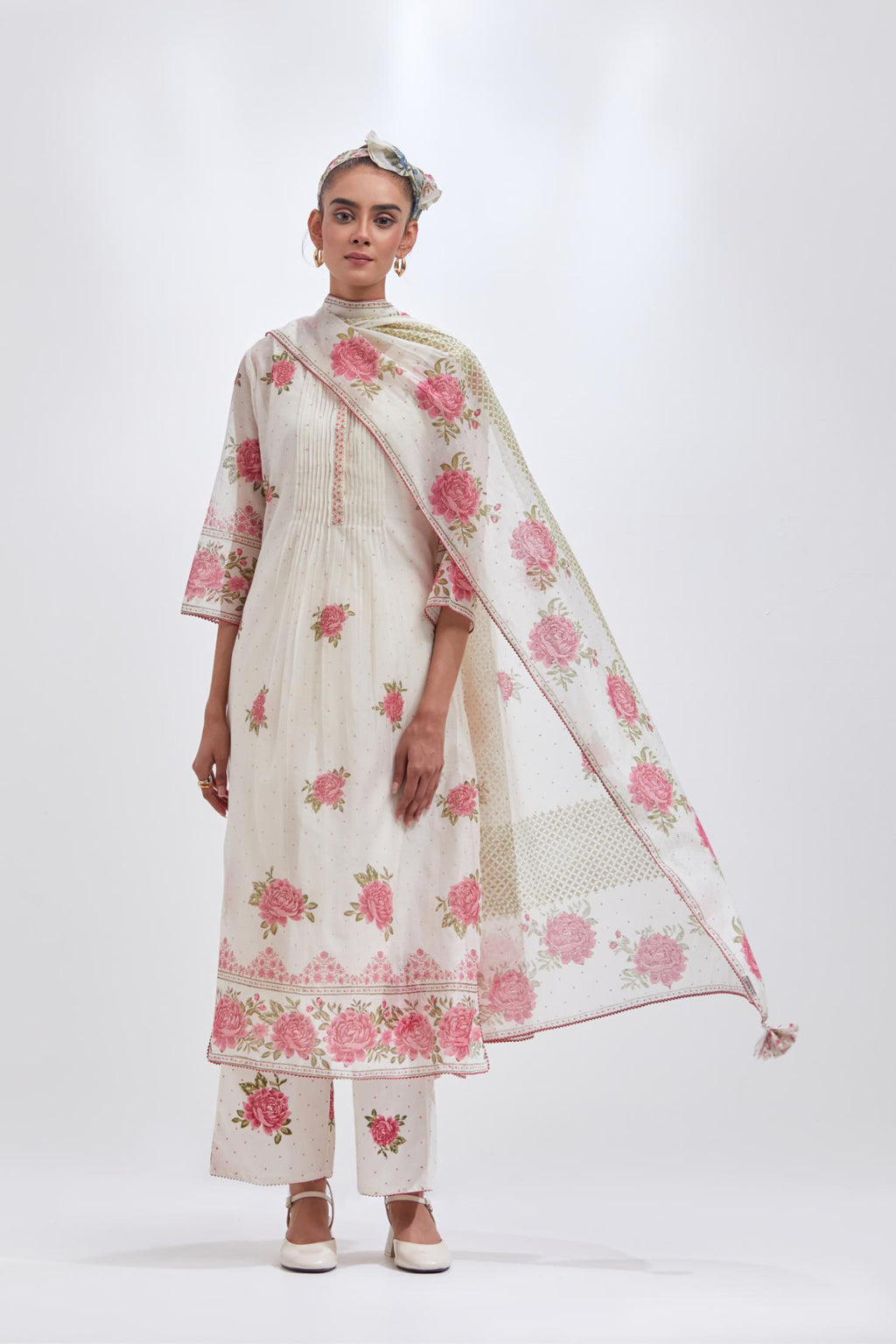 Off white cotton chanderi straight kurta set with all-over pink & green hand block print, highlighted with pin tucks at yoke.