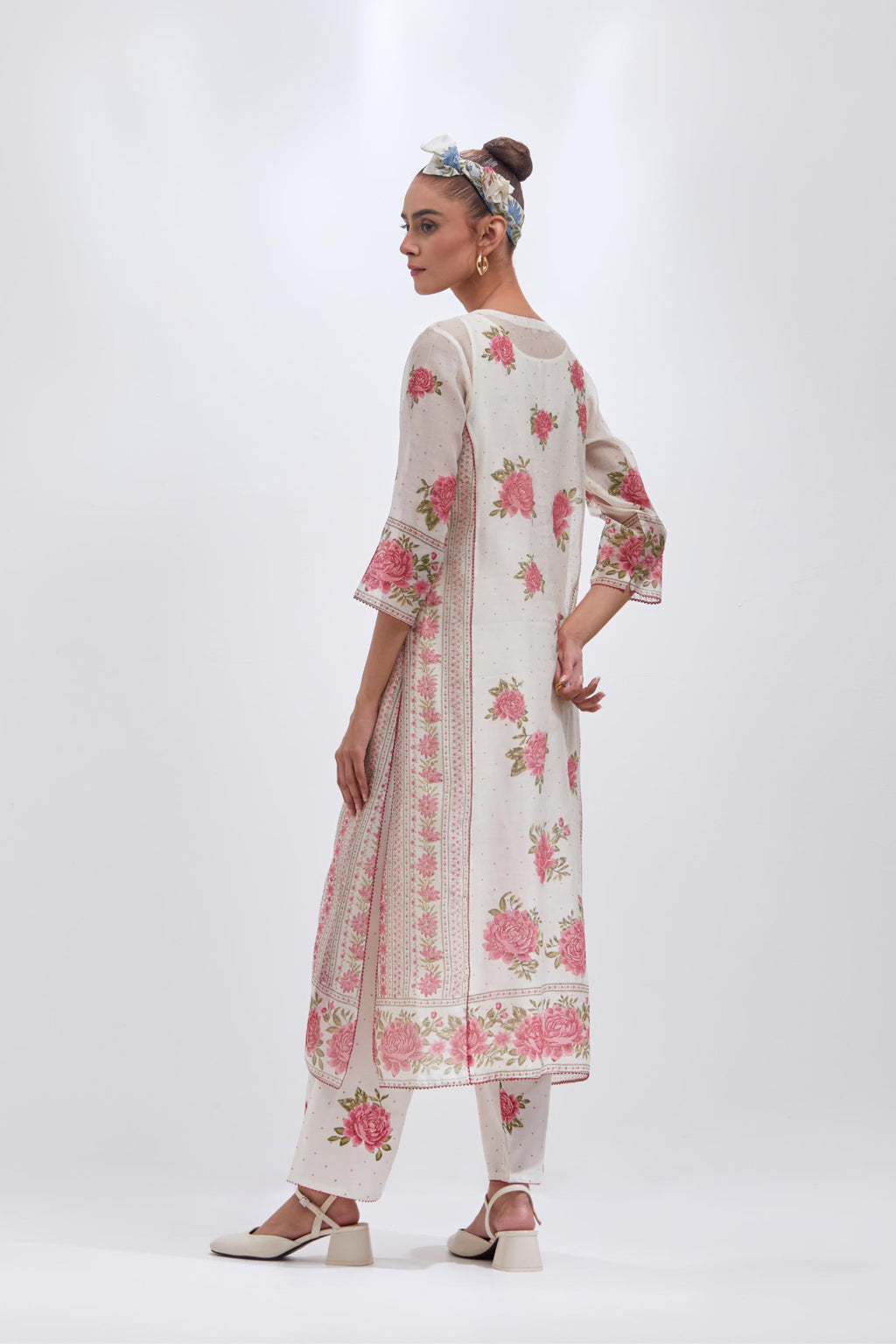Off white cotton chanderi kurta set with all-over pink & green floral hand-block print and side panels.
