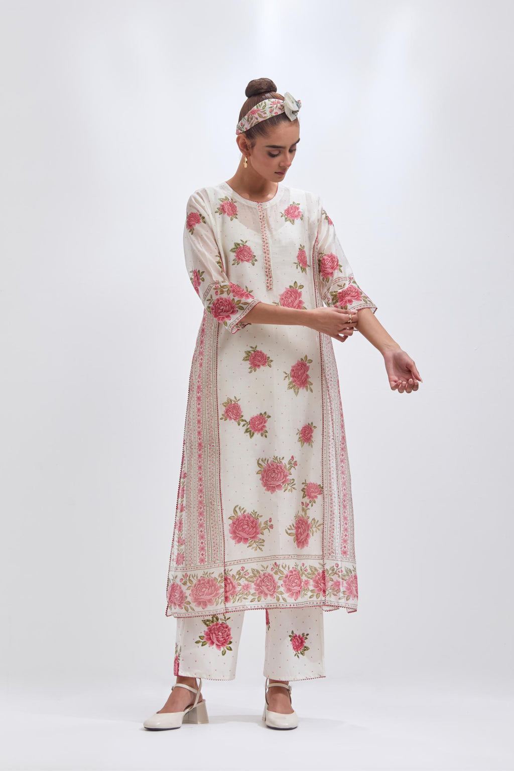 Off white cotton chanderi kurta set with all-over pink & green floral hand-block print and side panels.