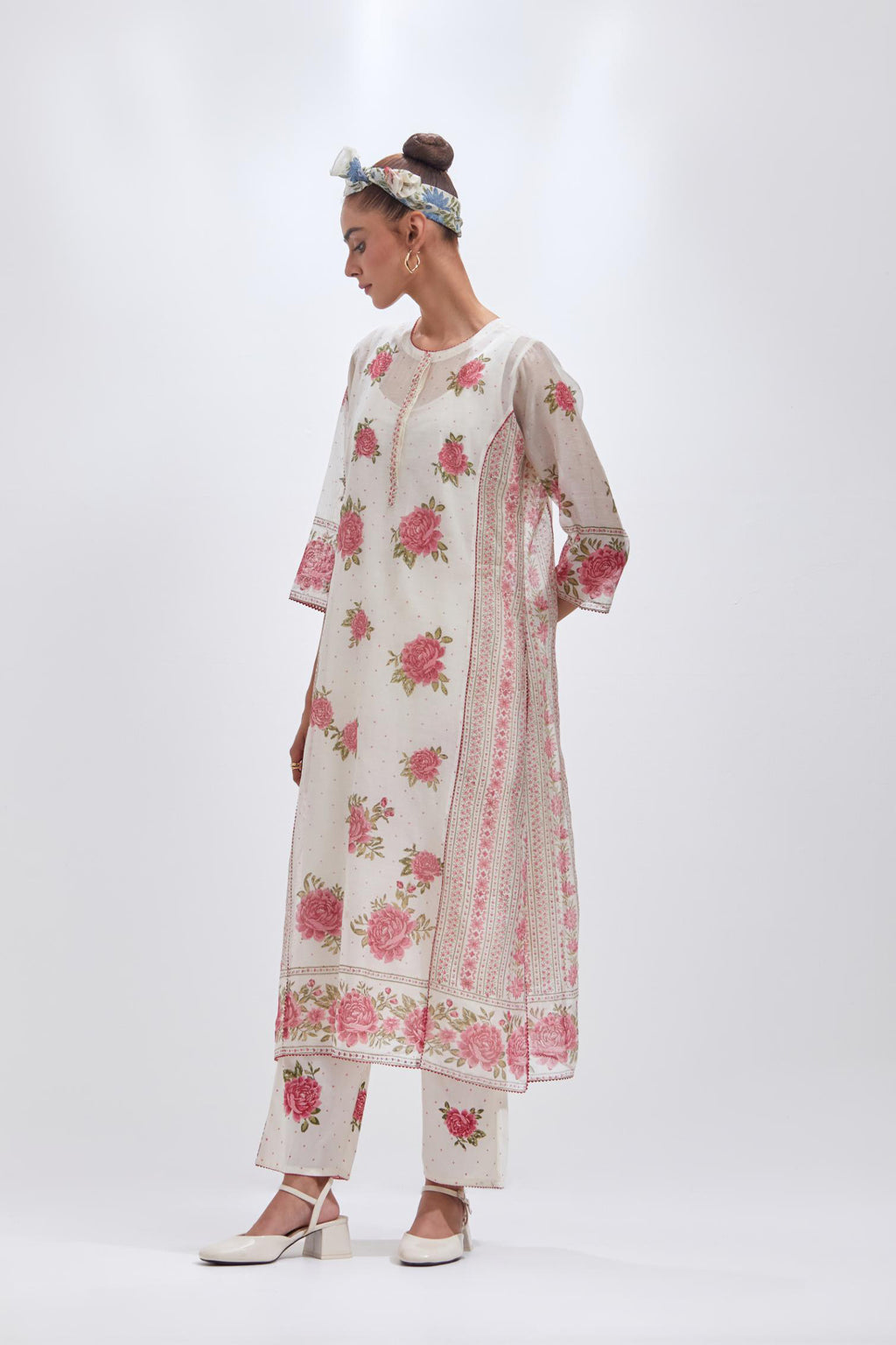 Off white cotton chanderi kurta set with all-over pink & green floral hand-block print and side panels.
