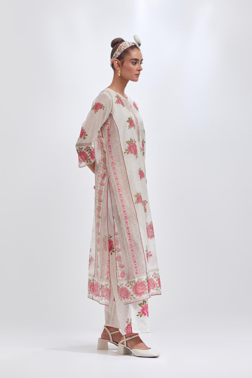 Off white cotton chanderi kurta set with all-over pink & green floral hand-block print and side panels.